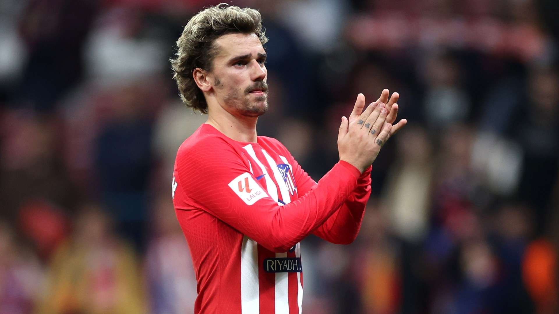 Antoine Griezmann of Atletico Madrid applauds