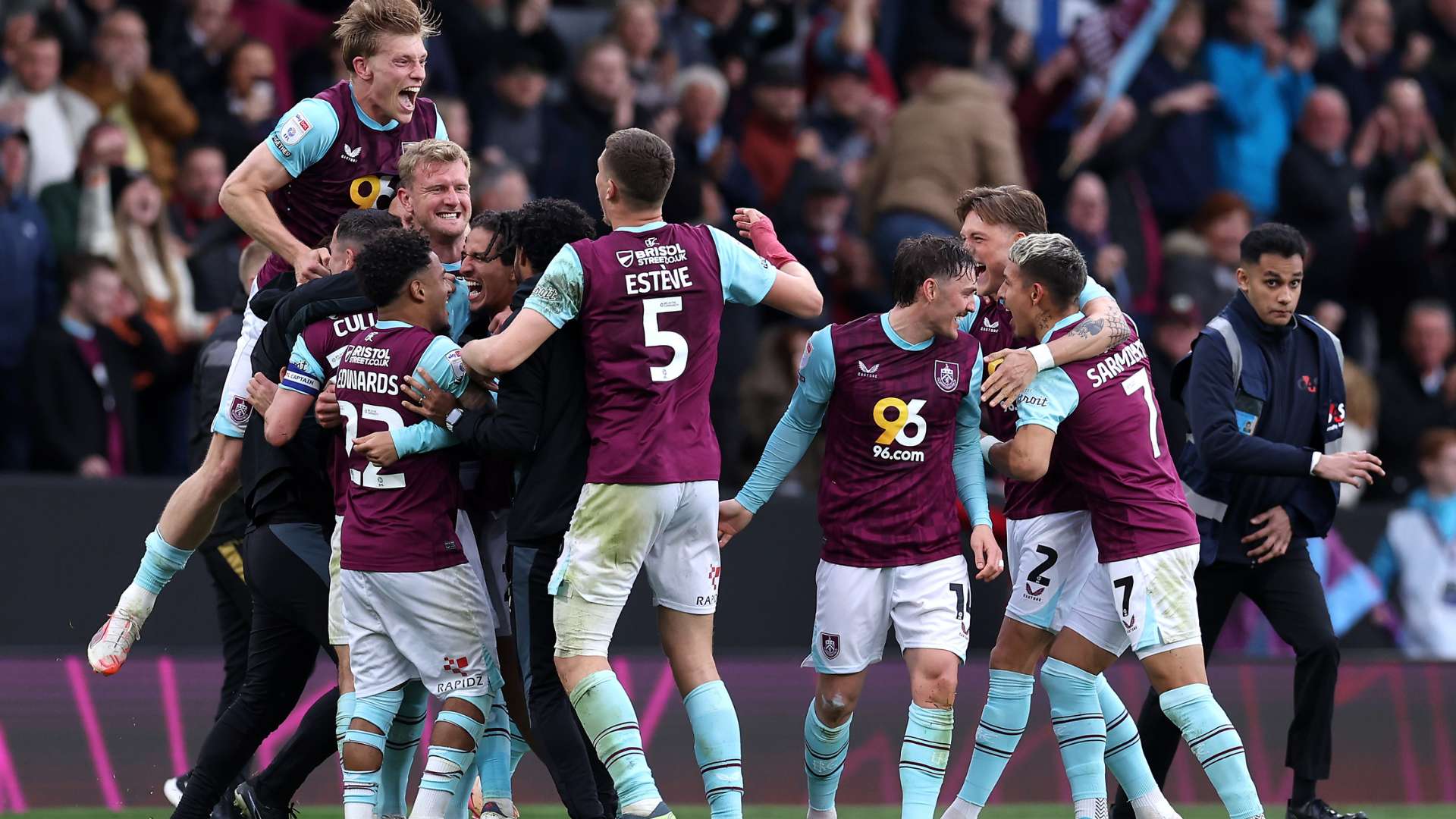 The players of Burnley celebrate at full-time following the team's victory and subsequent promotion to the Premier League