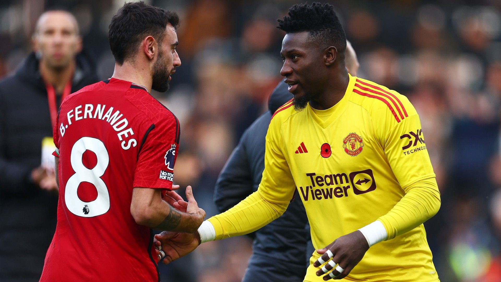 Bruno Fernandes of Manchester United interacts with teammate Andre Onana