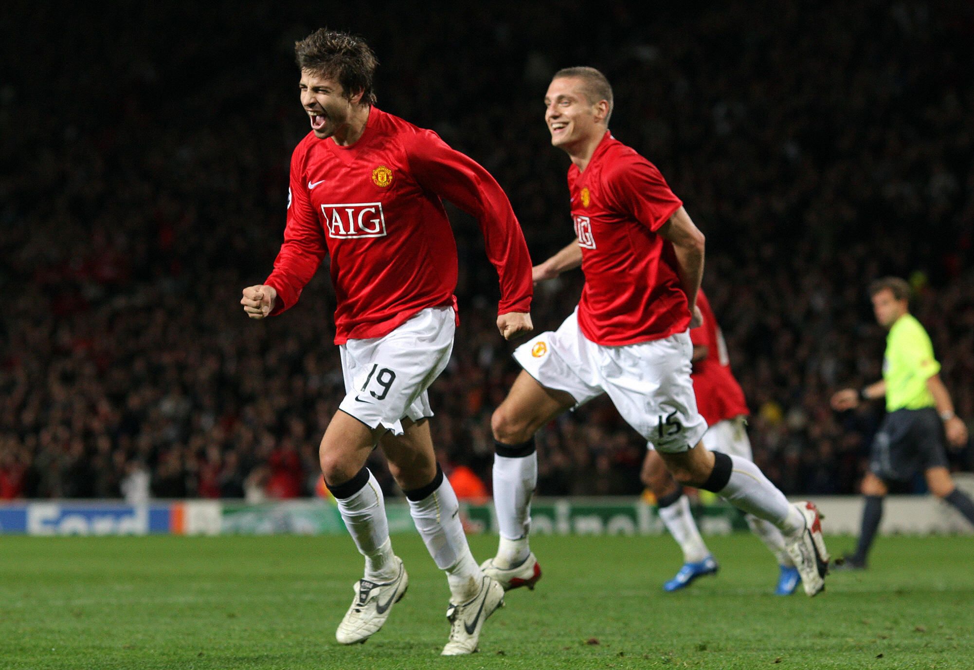 Manchester United's Gerard Pique (L) celebrates scoring from a header against Dynamo Kiev