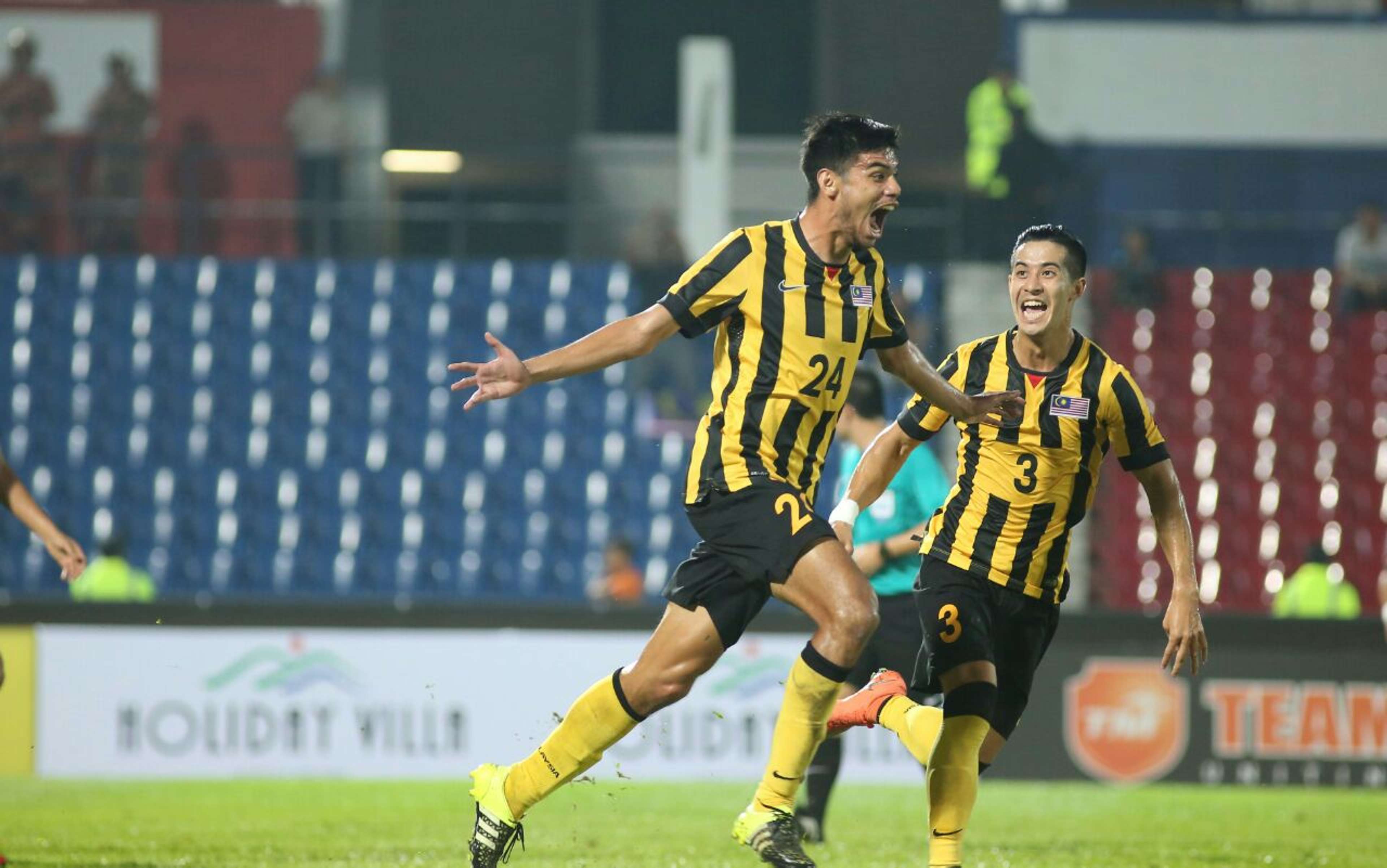 Malaysia's Khair Jones (left) celebrating his goal with Brendan Gan 2016