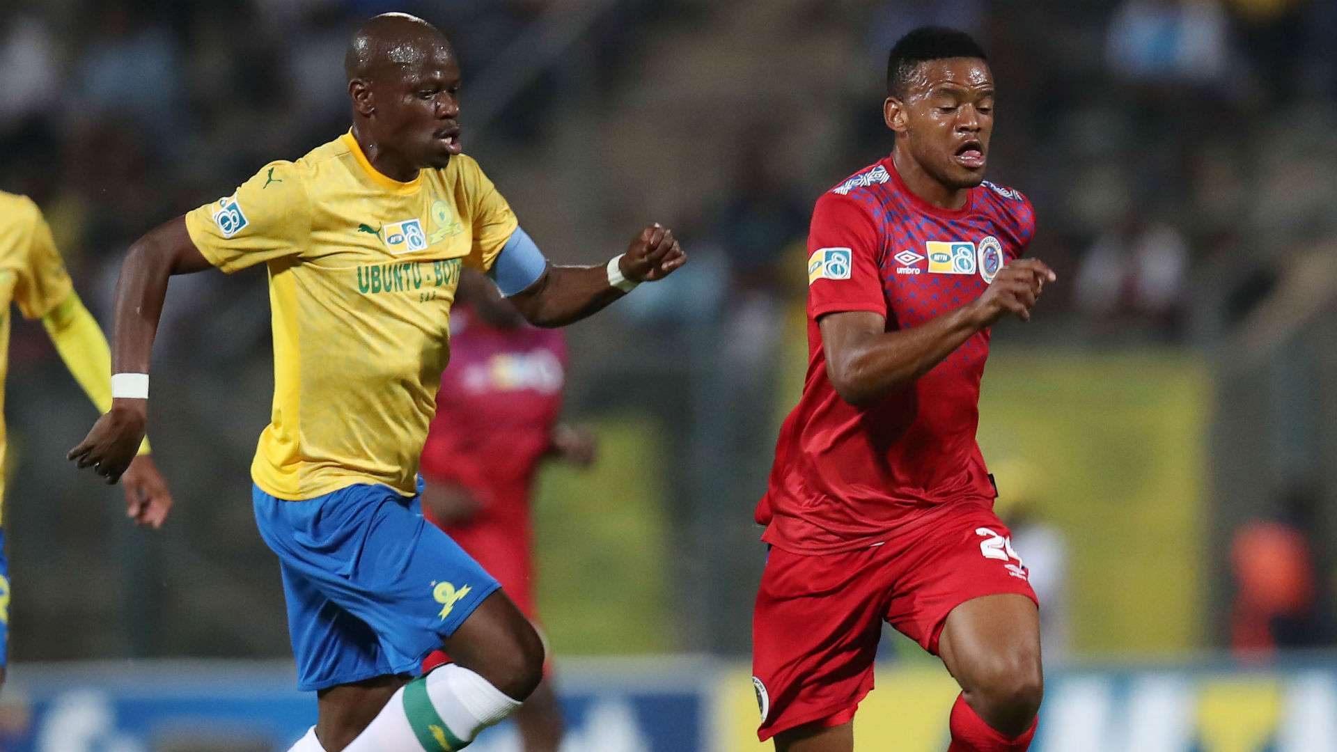 Sipho Mbule of SuperSport United challenged by Hlompho Kekana of Mamelodi Sundowns, September 2019