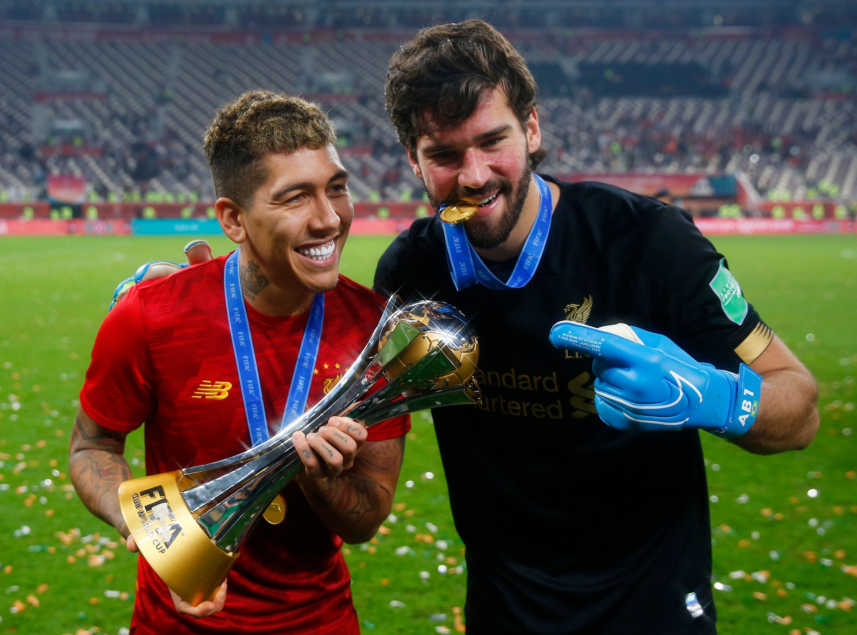 Roberto Firmino and Alisson Becker