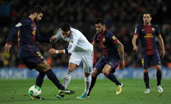 Mesut Ozil, Gerard Pique - Barcelona v Real Madrid - Clasico