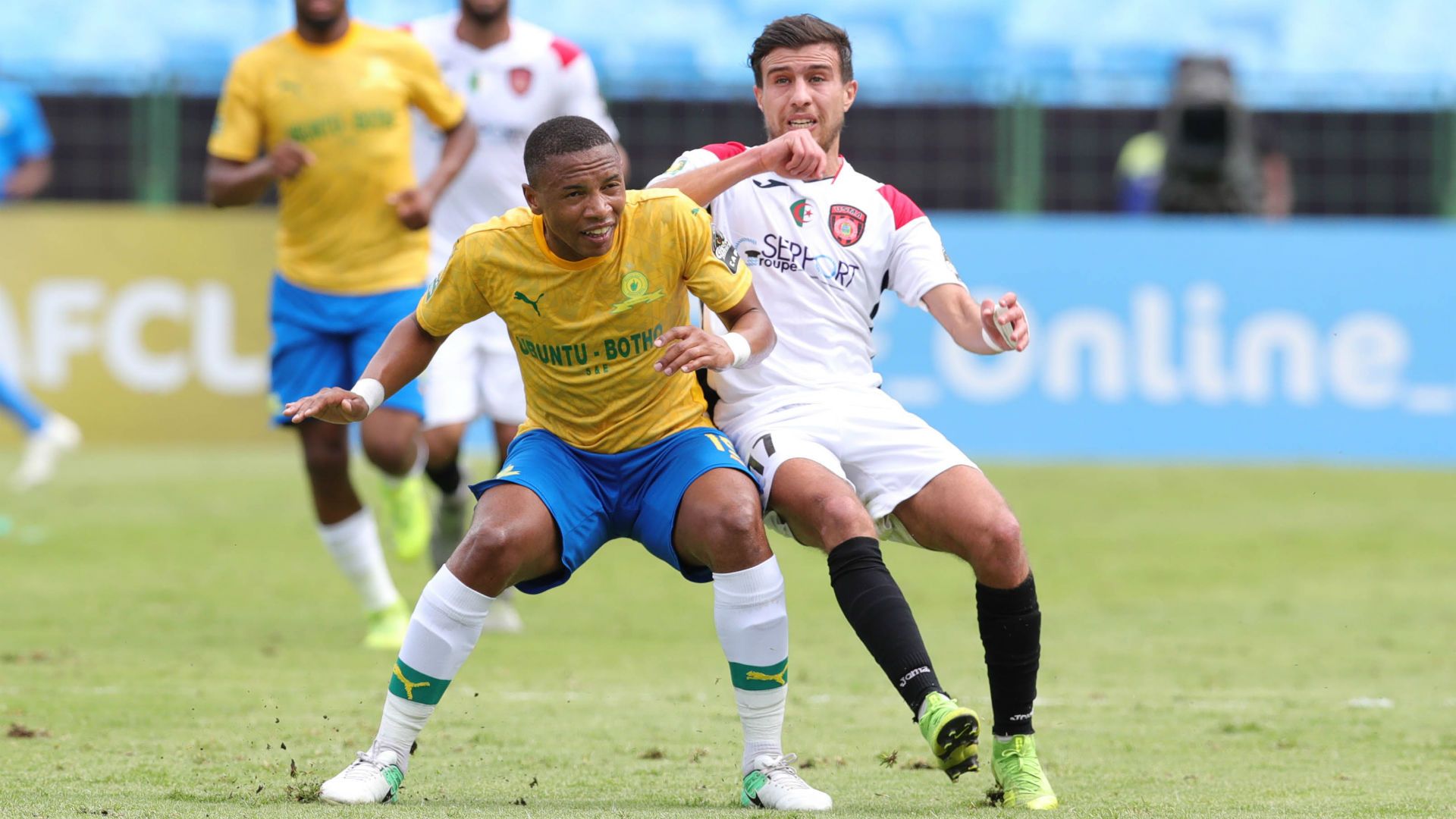 Andile jali of Mamelodi Sundowns challenged by Tahar Benkhlifa of USM Alger, January 2020