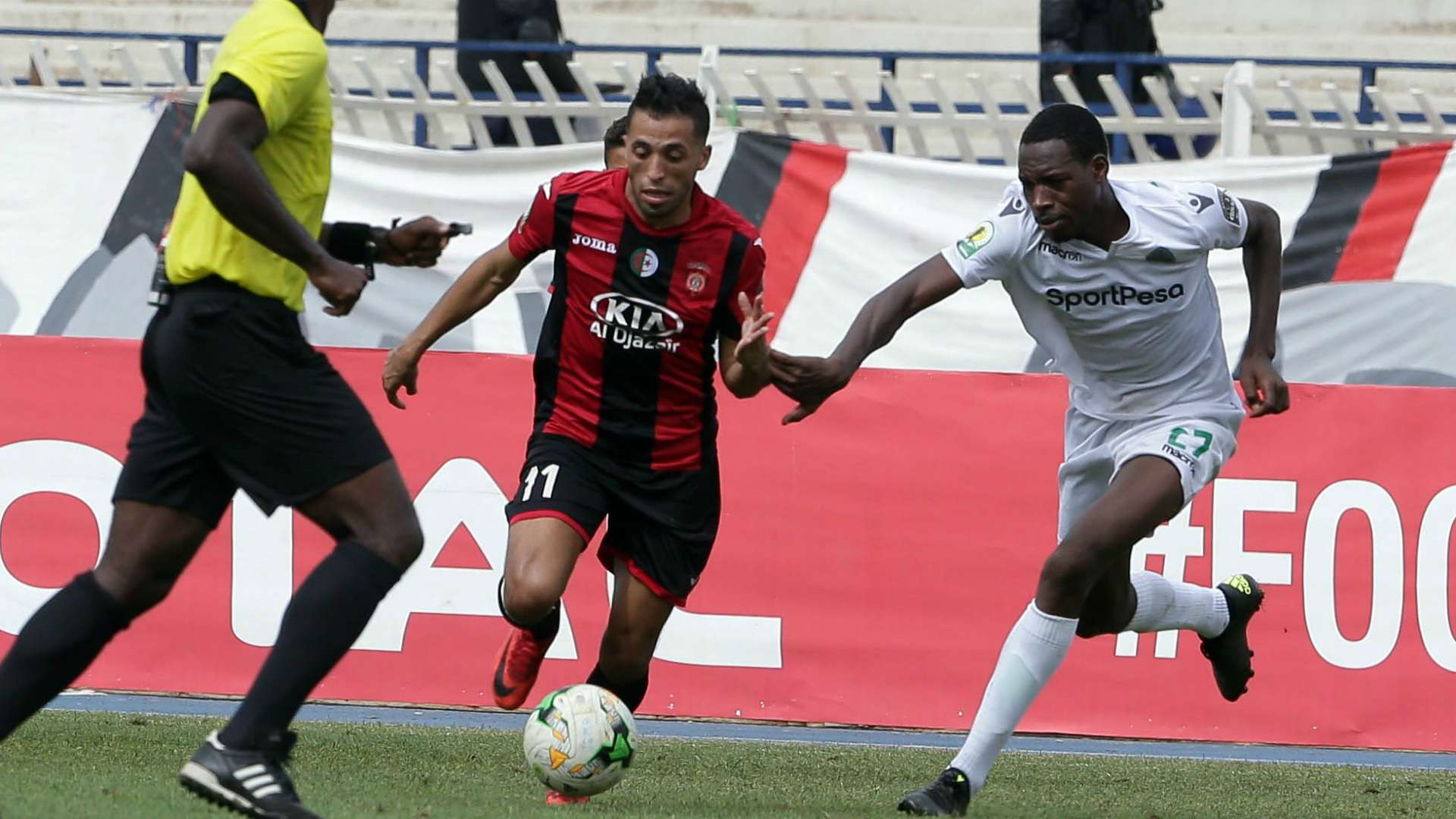 USM Alger player Abderrahmane Meziane (L) and Gor Mahia FC player Charles Momanyi.