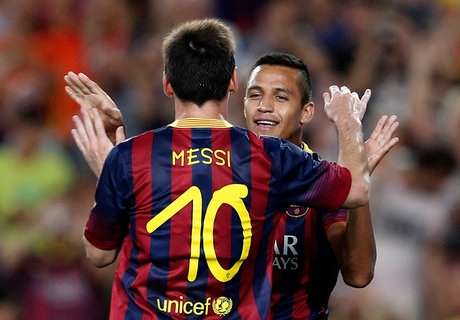 Alexis Sanchez and Lionel Messi celebrate for Barcelona in their friendly against Santos