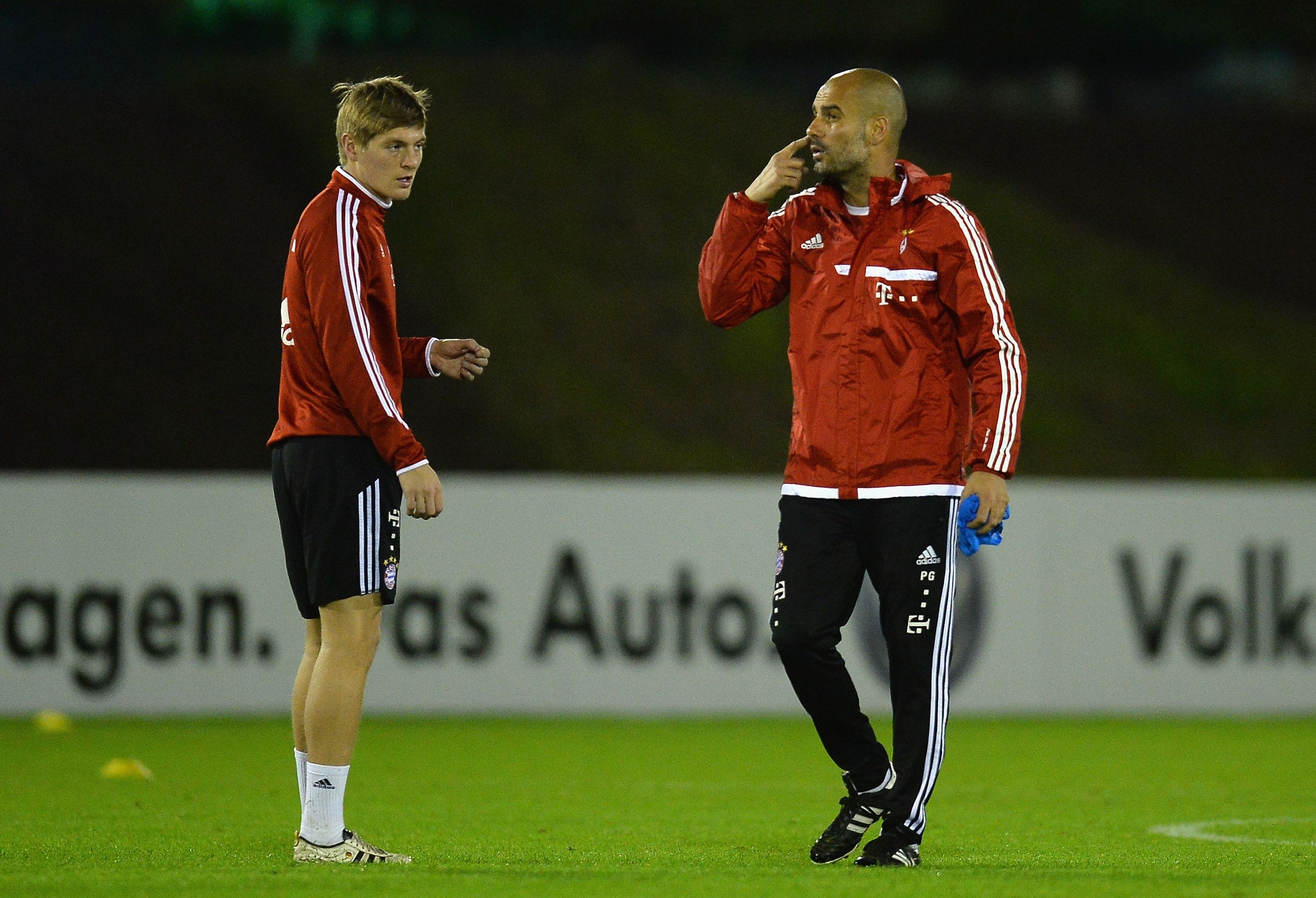 Bayern Munich midfielder Toni Kroos and coach Pep Guardiola