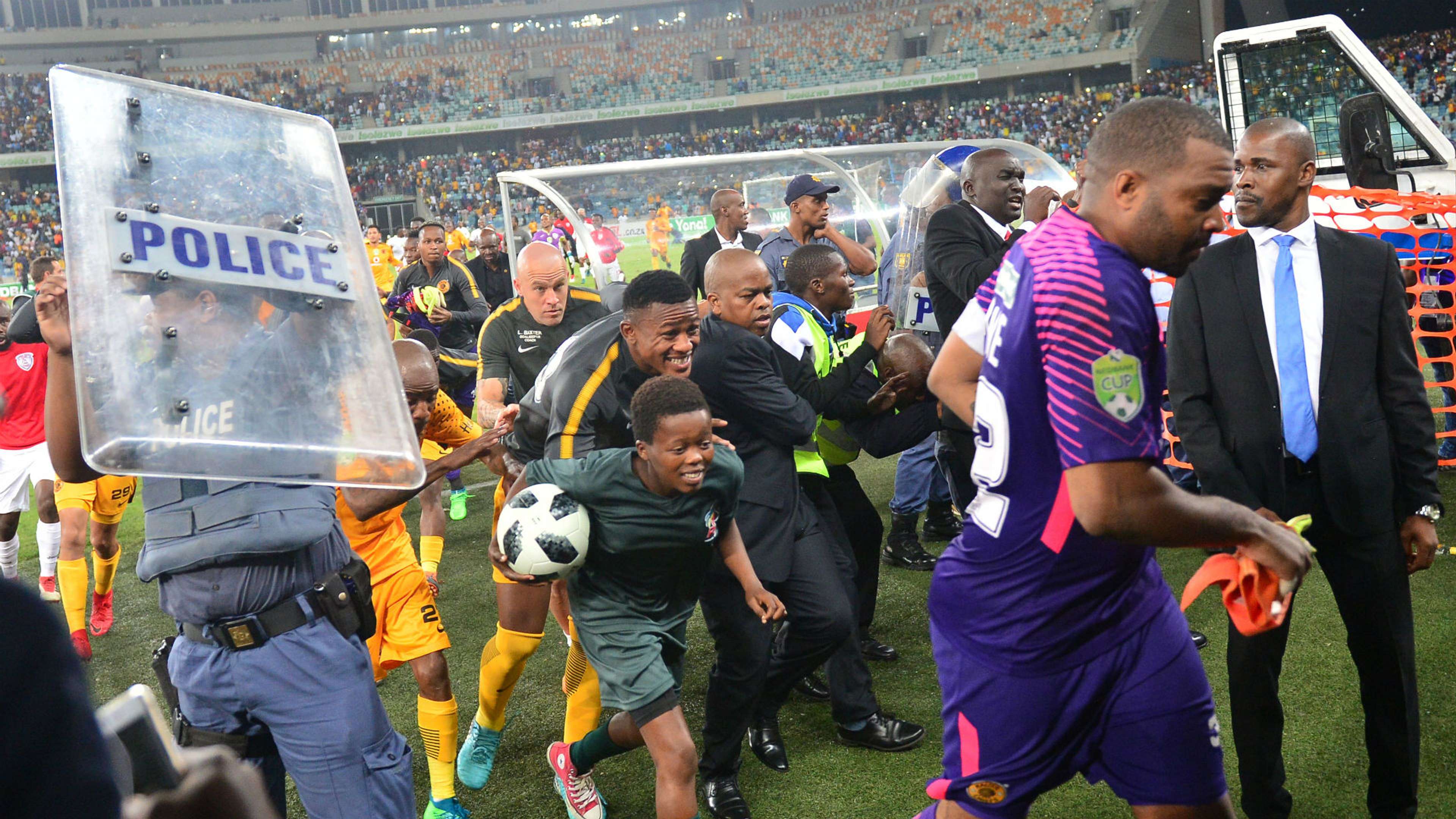 Kaizer Chiefs players run for cover at Moses Mabhida Stadium