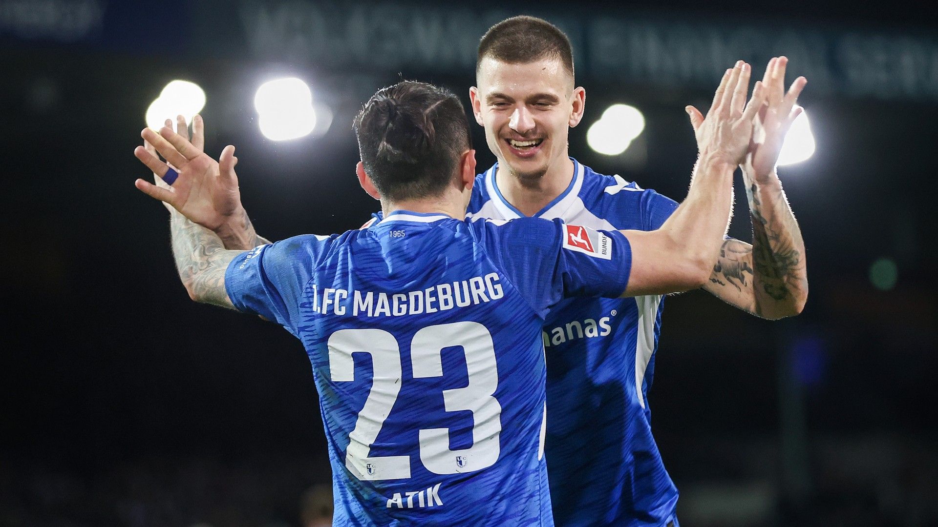 Baris Atik (L) of 1. FC Magdeburg celebrates scoring his teams second goal with his teammate Mateusz Zukowski 
