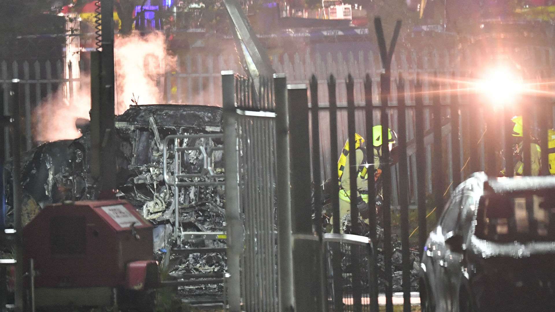 Emergency services work at the scene on the wreckage of a helicopter in Leicester 2018