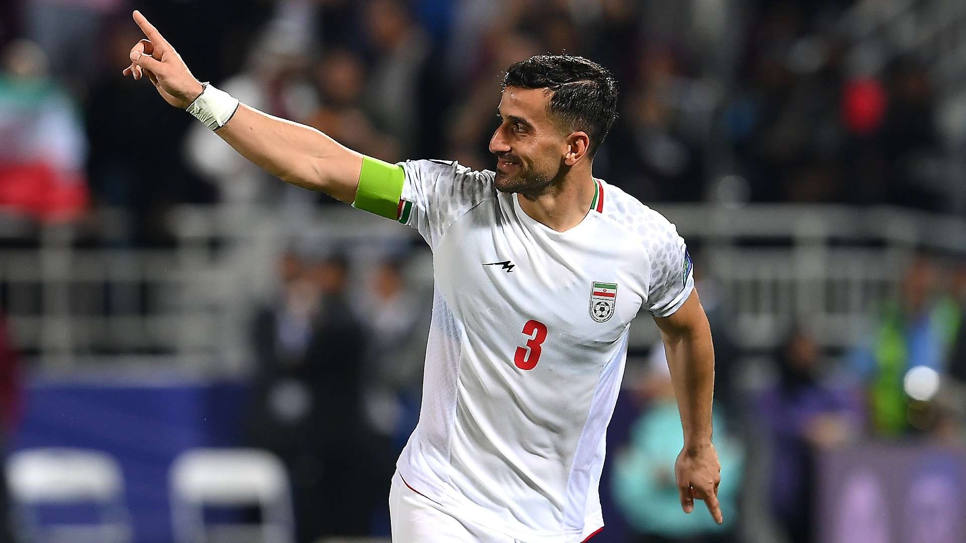 Ehsan Hajsafi of Iran celebrates victory