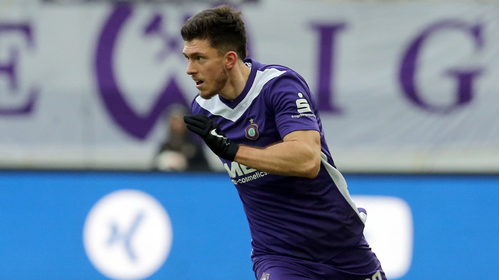 Linus Rosenloecher of Aue runs with the ball