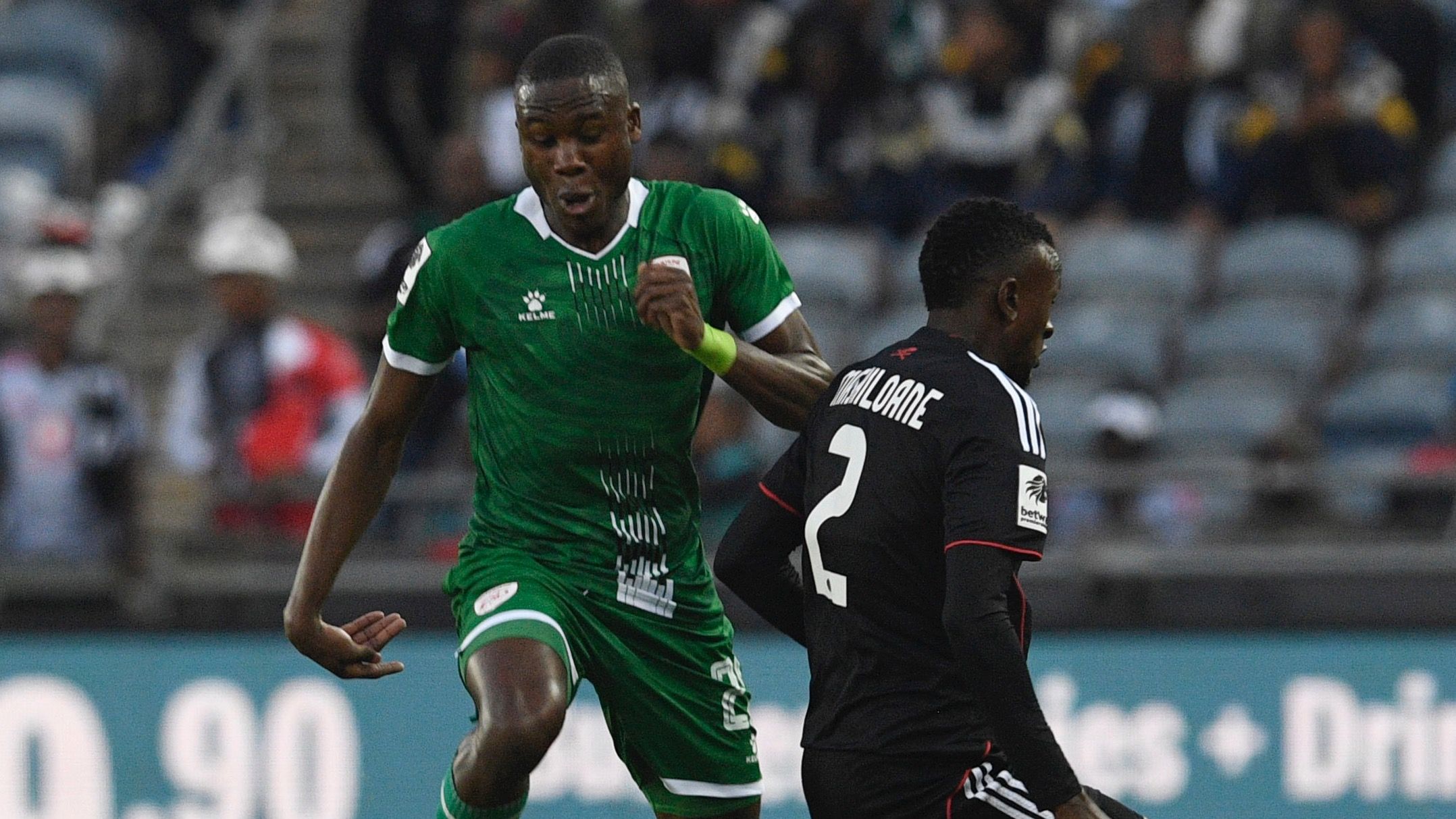 Katlego Letllapa of Sekhukhune United and Tshepo Mashiloane of Orlando Pirates