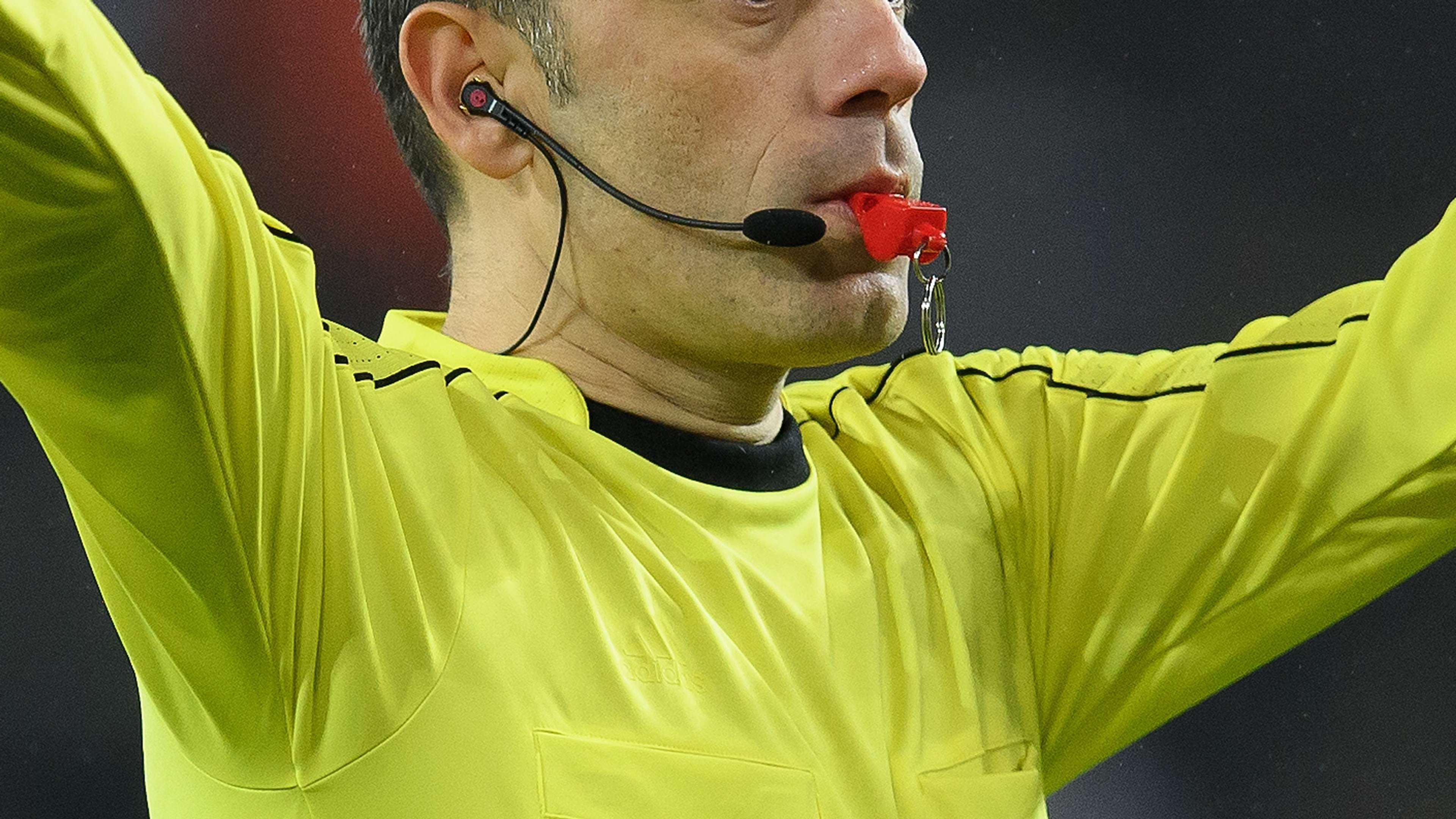 Referee blows