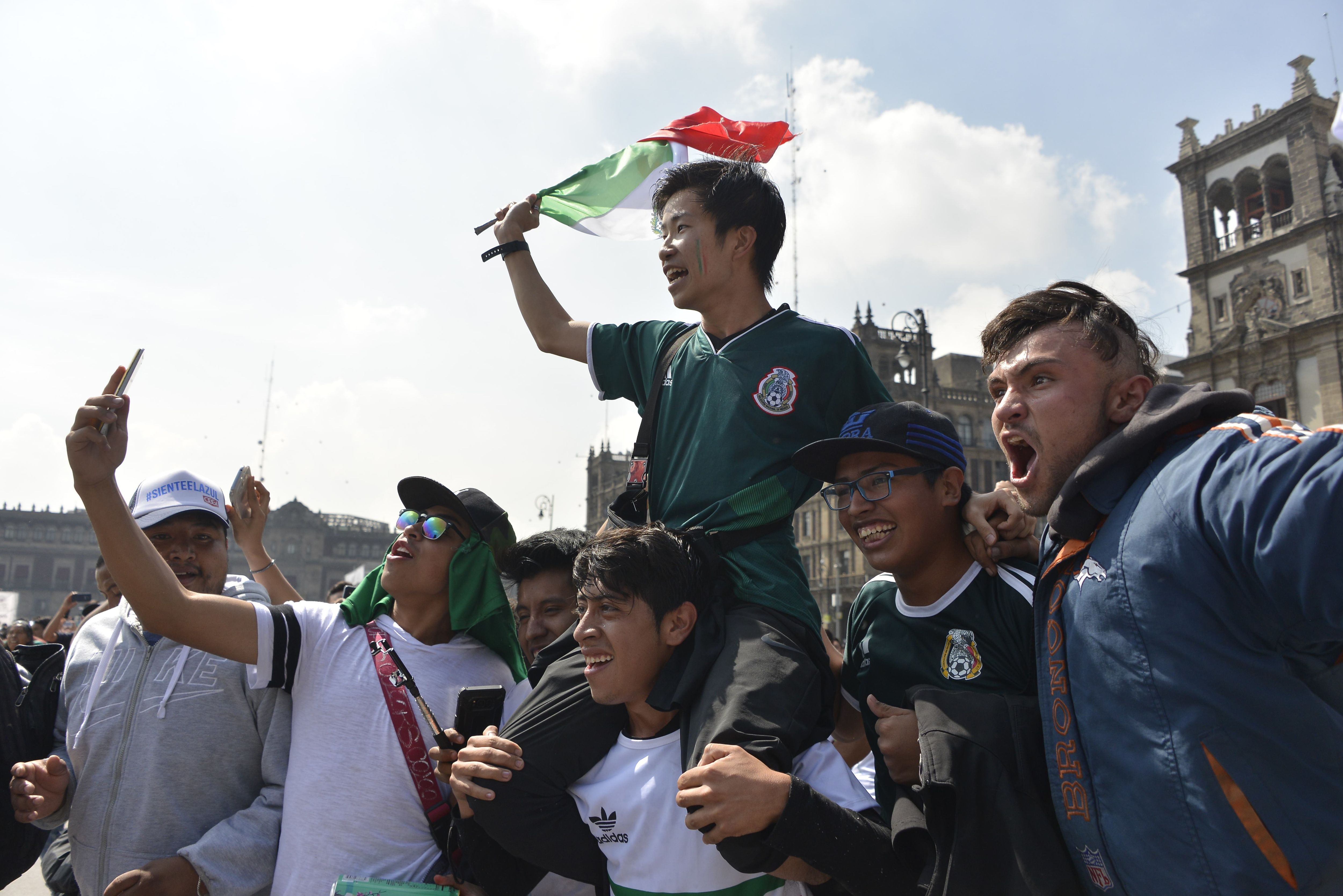 Mexico fans carrying Korean man
