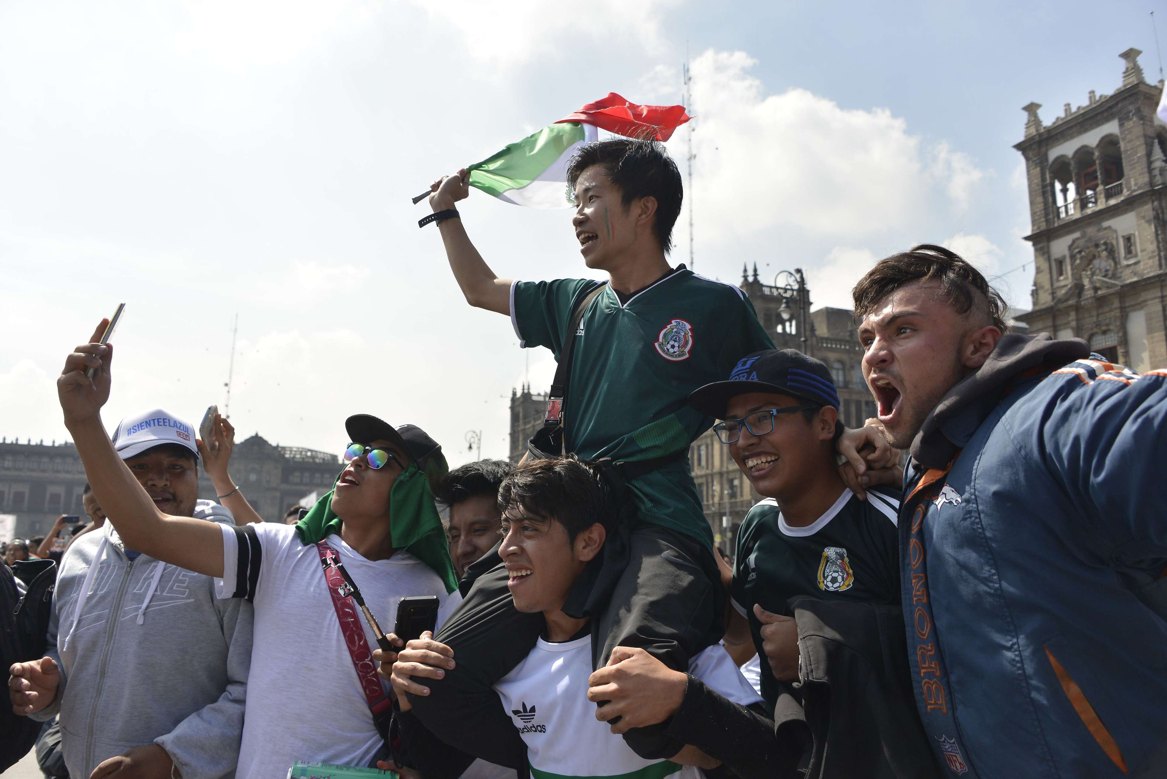 Mexico fans carrying Korean man