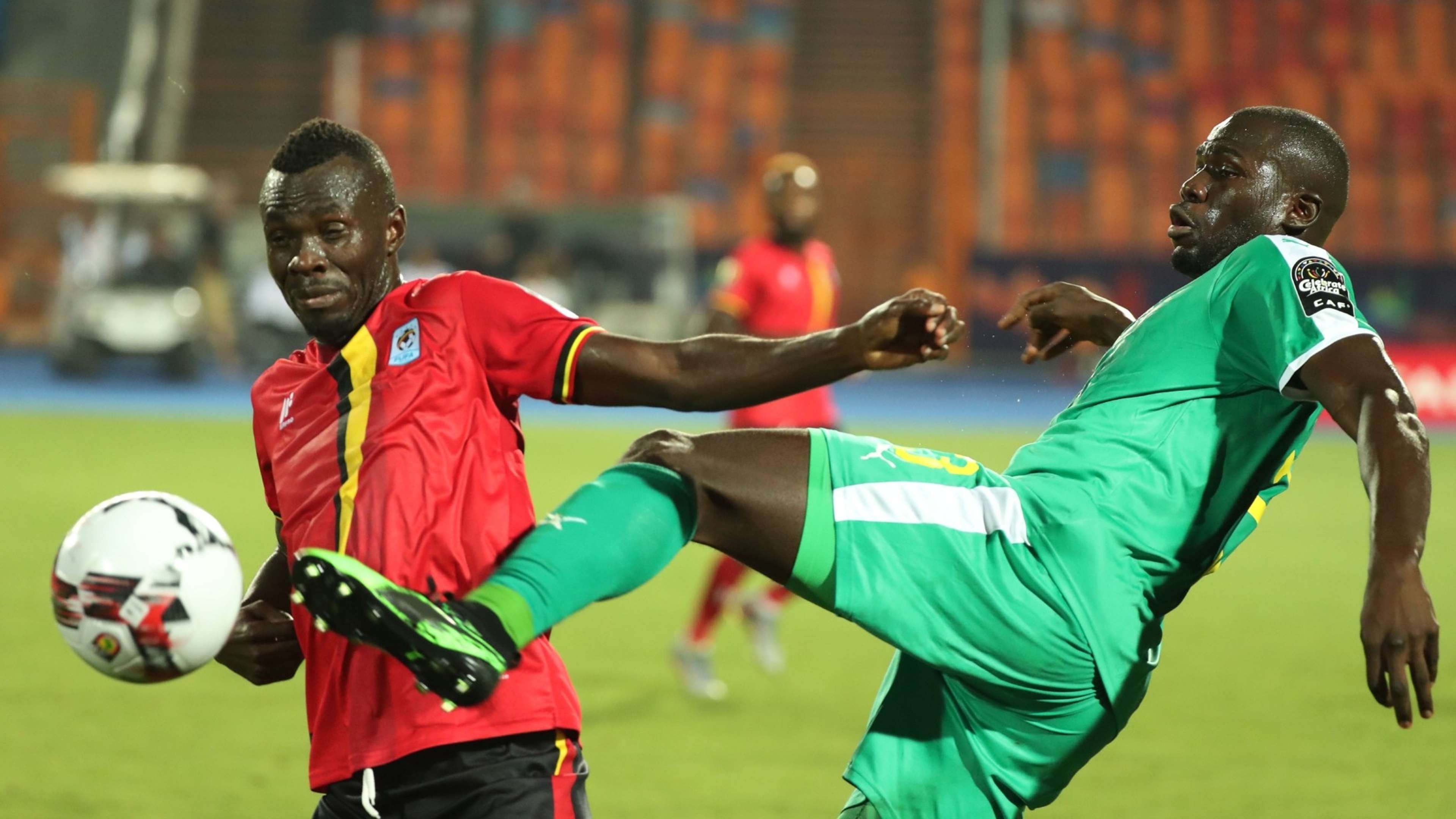 Kalidou Koulibaly of Senegal clears ball from Emmanuel Okwi of Uganda.