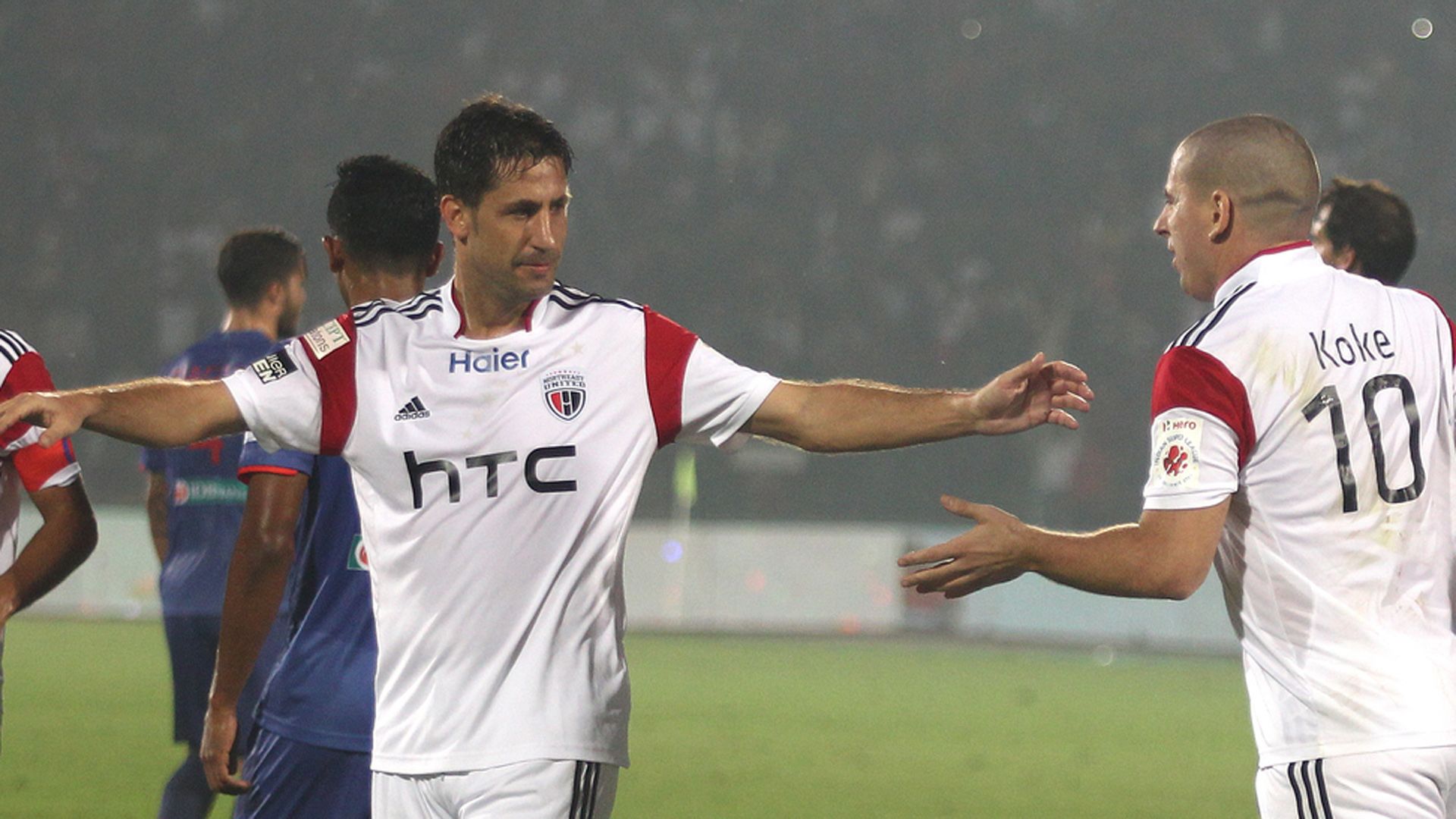 Joan Capdevila and Koke of NorthEast United FC in action during ISL match against Mumbai City FC