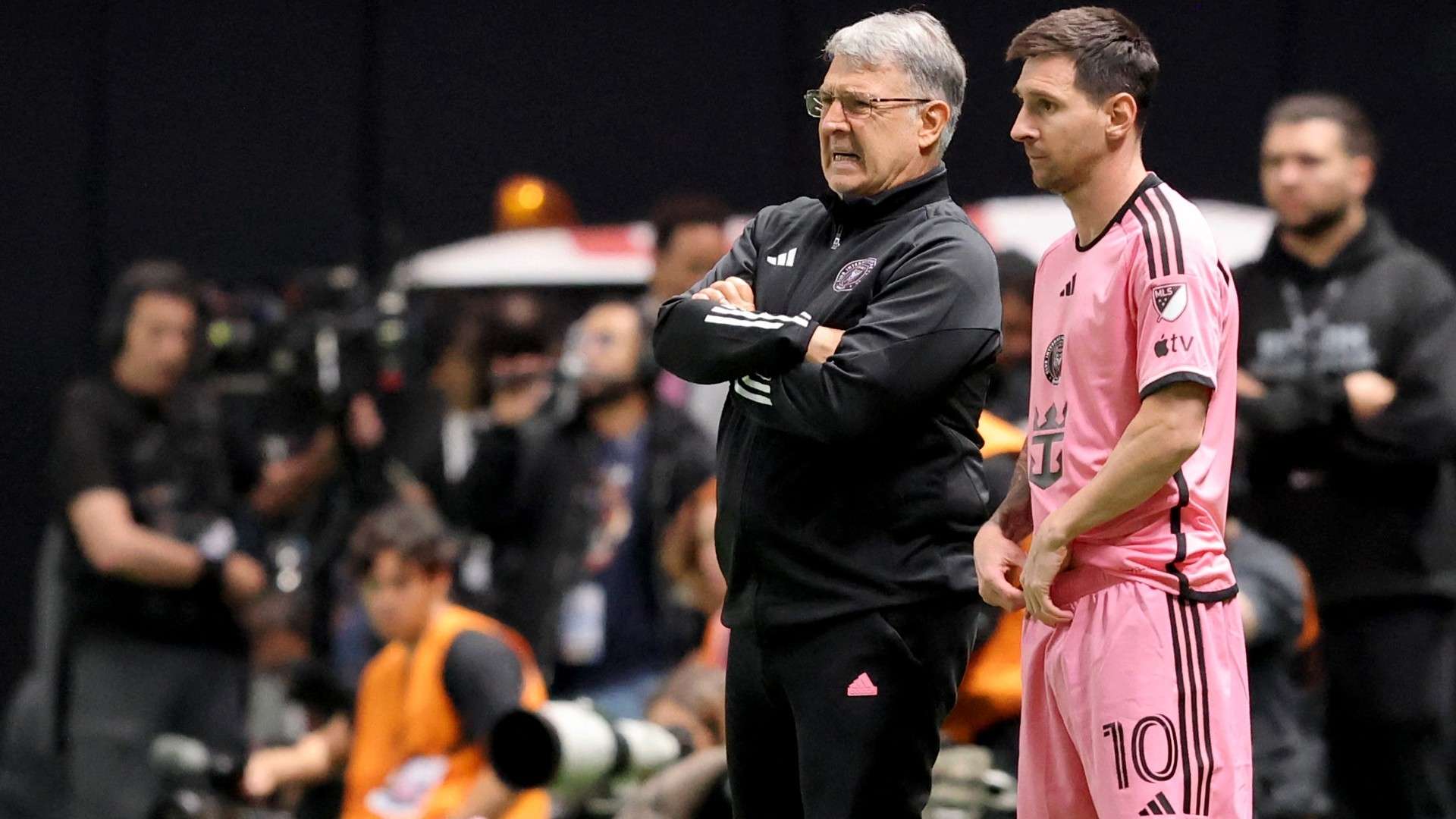 Inter Miami's Argentine coach Gerardo Martino stands with his Argentine forward #10 Lionel Messi