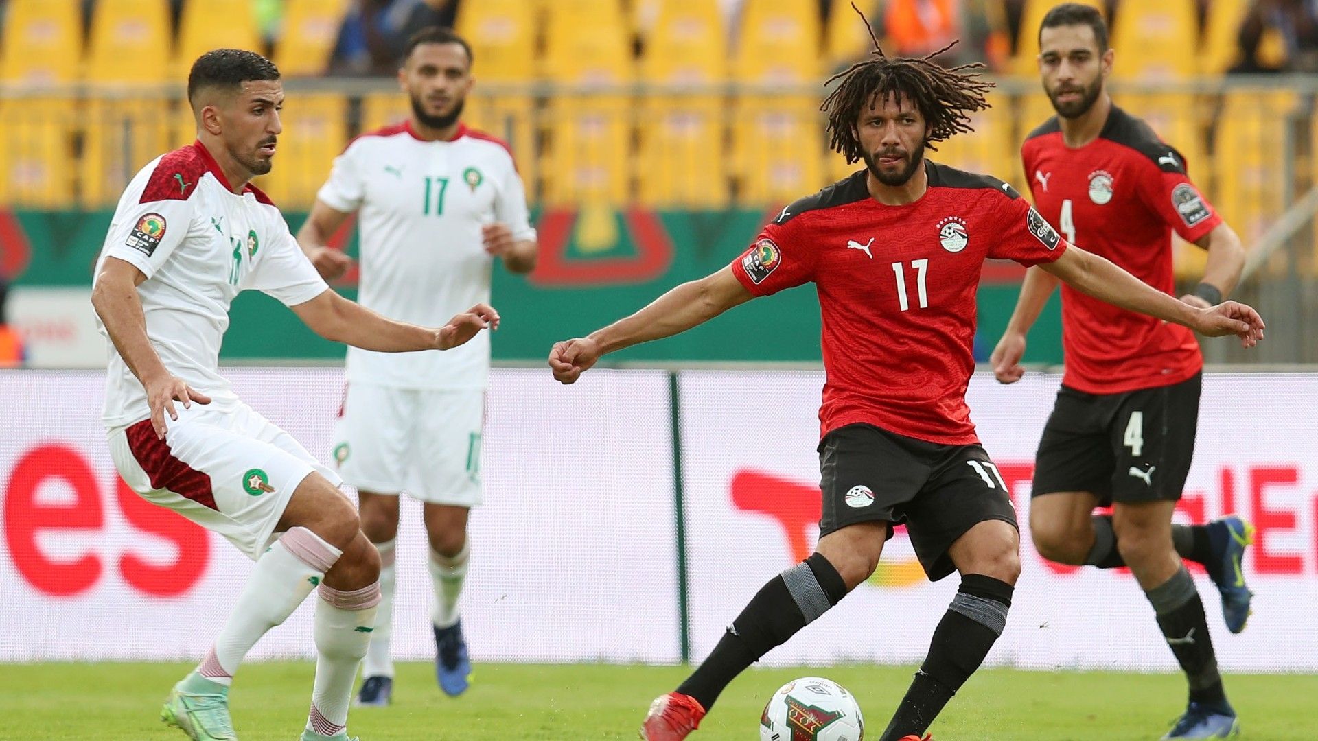 Mohamed Elneny of Egypt challenged by Aymane Barkok of Morocco.