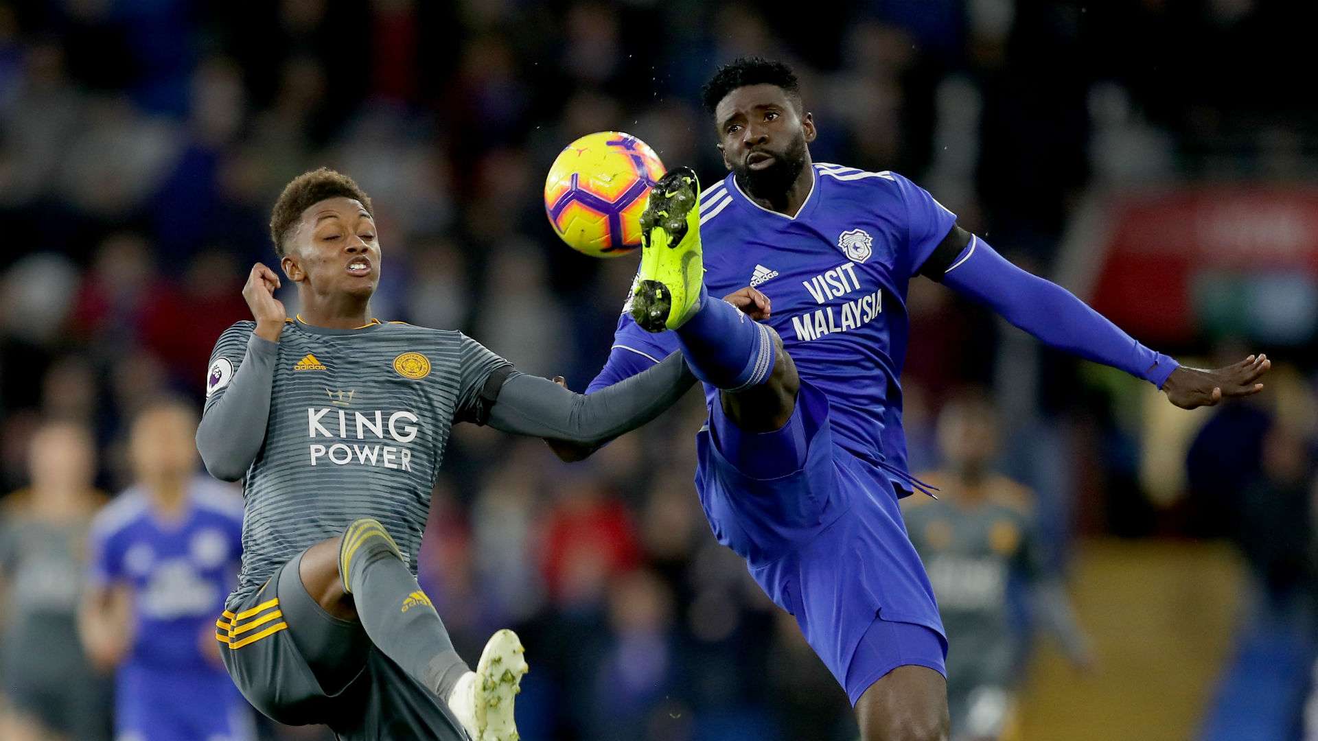 Demarai Gray of Leicester City battles for possession with Bruno Ecuele Manga of Cardiff City