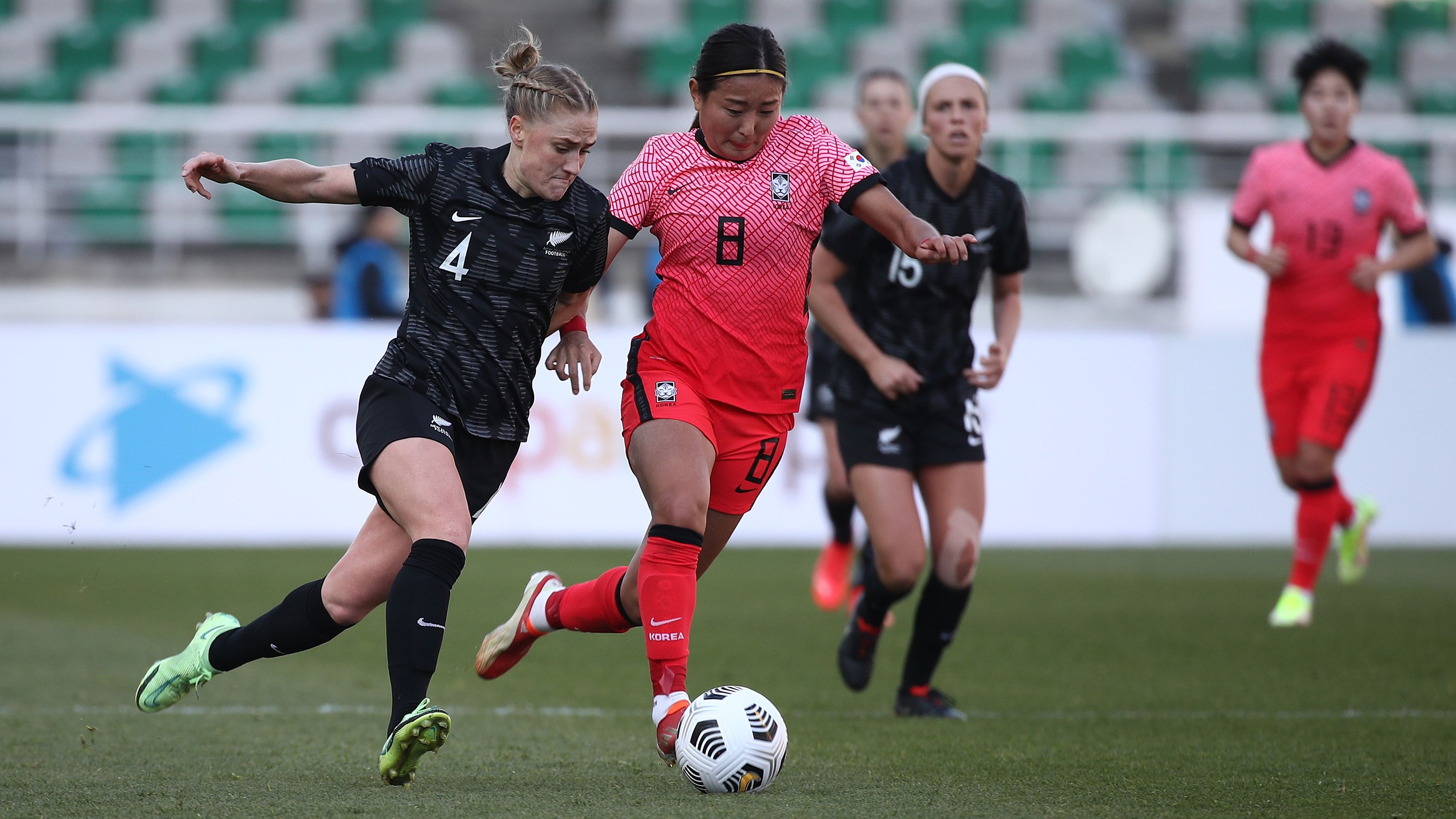 CJ Bott of New Zealand competes for the ball with Cho So-hyun of South Korea