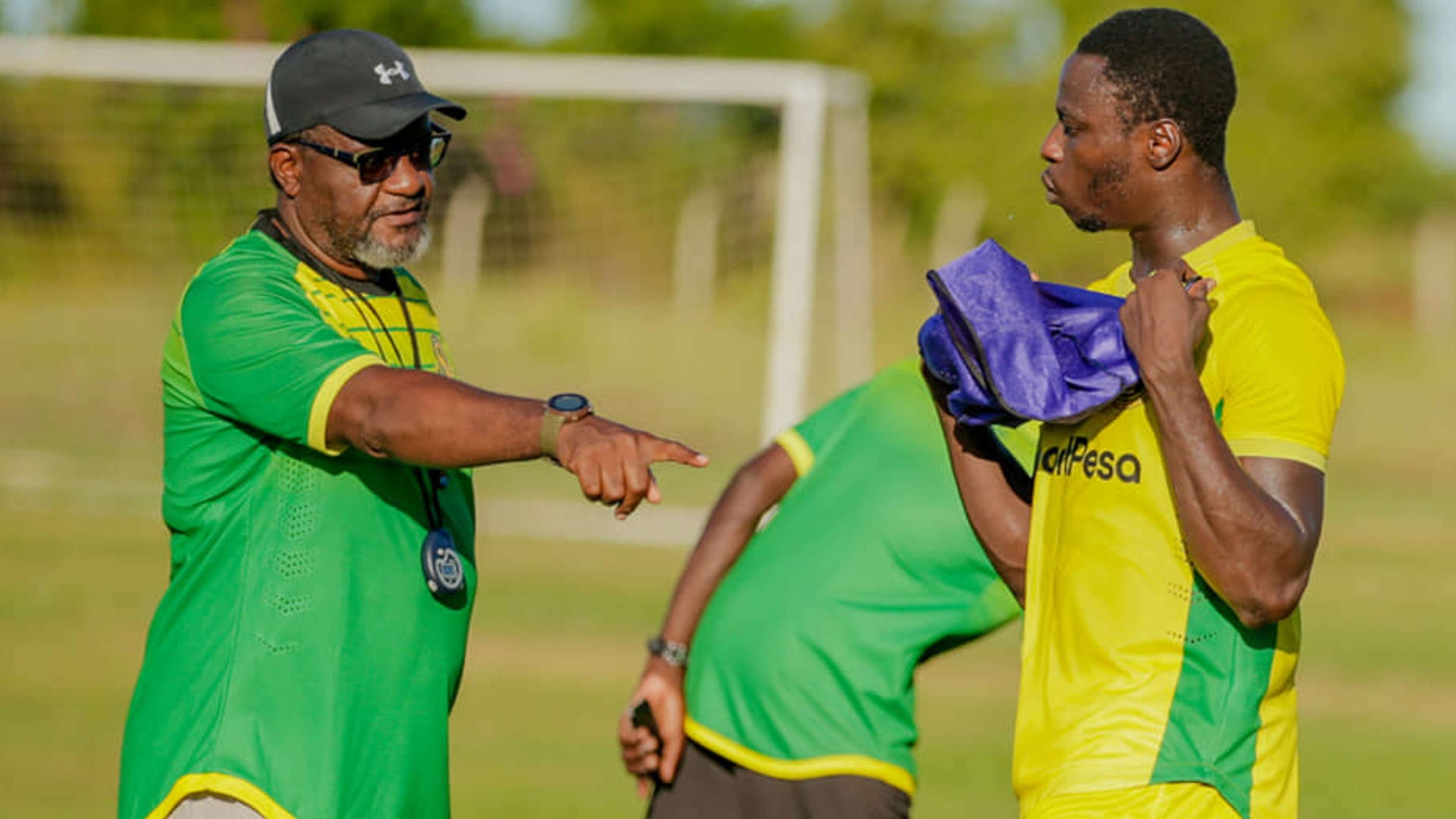 Yanga SC coach Juma Mwambusi and Michael Sarpong.