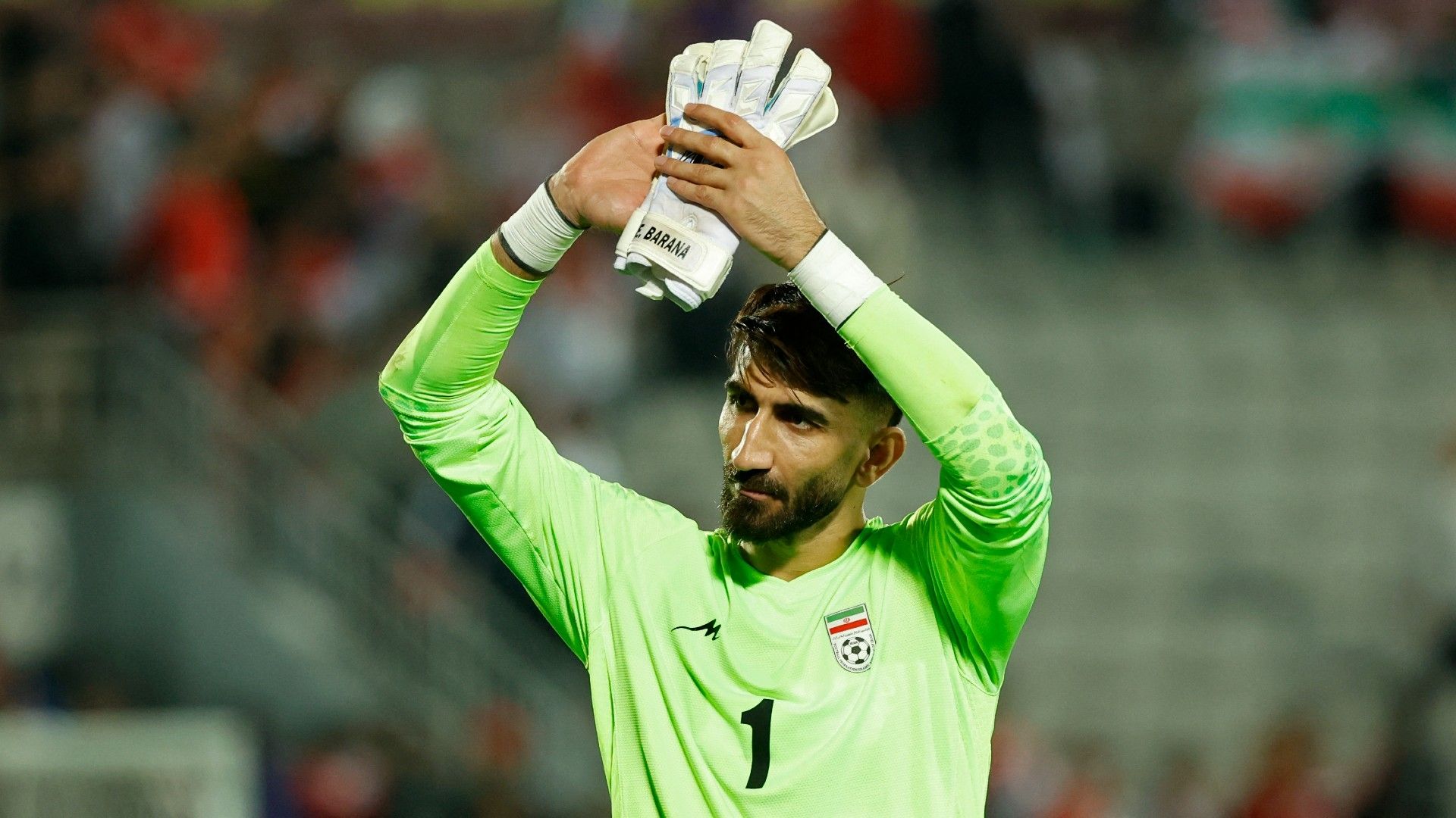 Iran's goalkeeper #01 Alireza Beiranvand applauds the fans