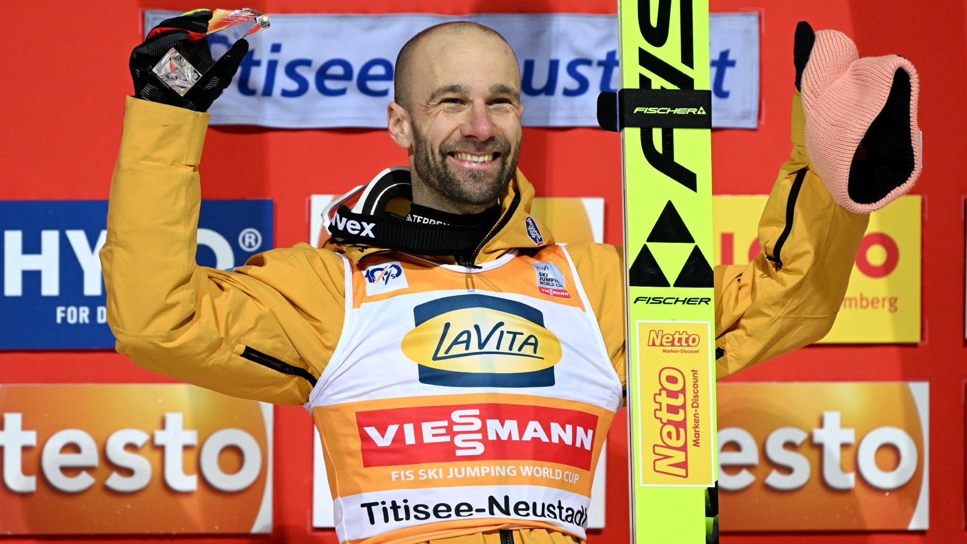 Germany's Pius Paschke celebrates with the trophy  