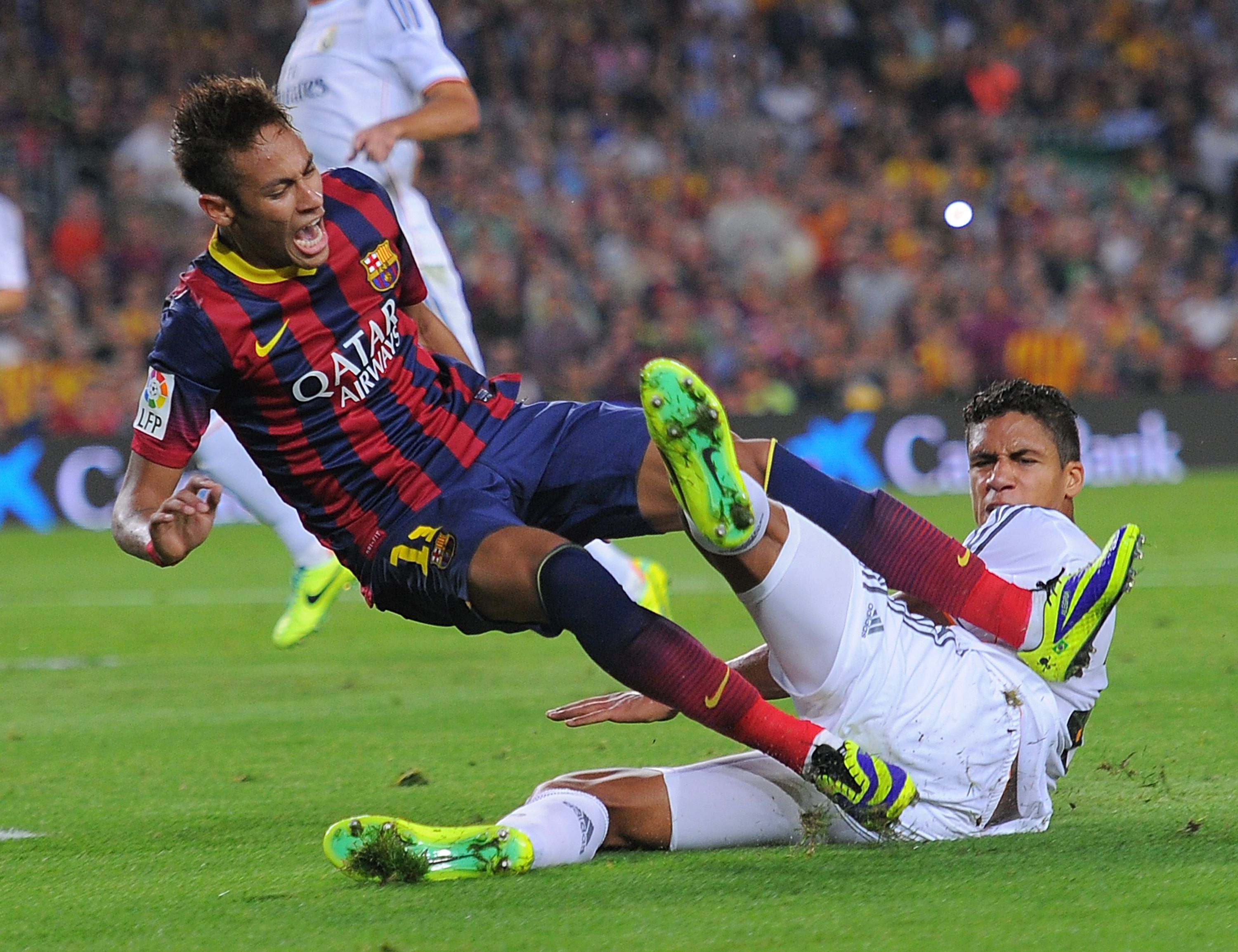 Barcelona's Neymar and Real Madrid's Raphael Varane