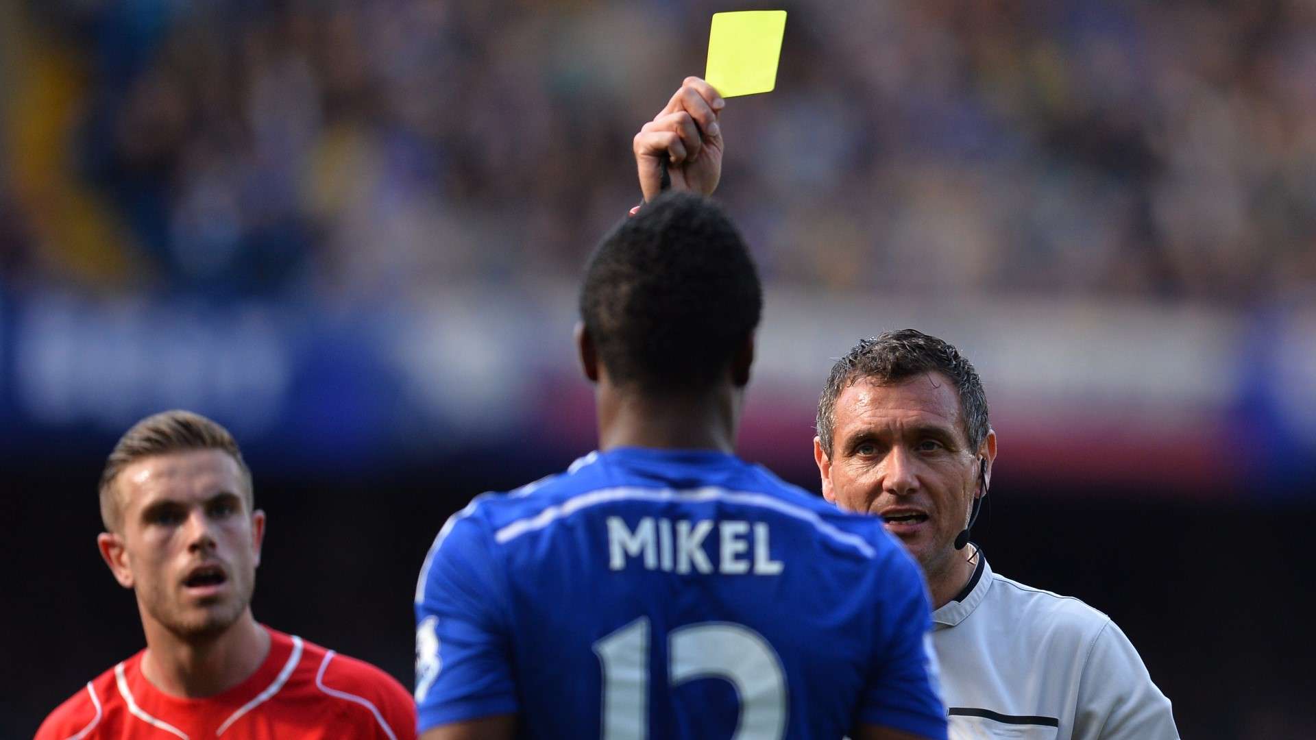 John Obi Mikel in action for Chelsea against Jordan Henderson's Liverpool