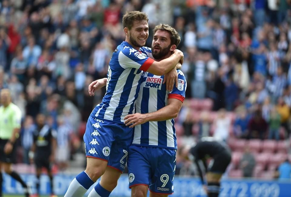 Will Grigg celebrates his goal against Blacburn