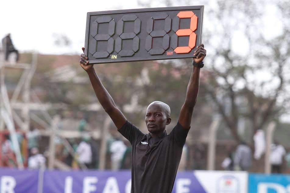 A fourth official displays board time during Nakuru All Stars v KCB tie