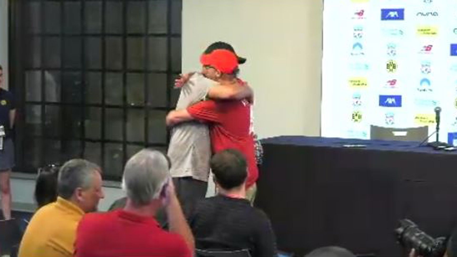 Jürgen Klopp FC Liverpool hugs reporter