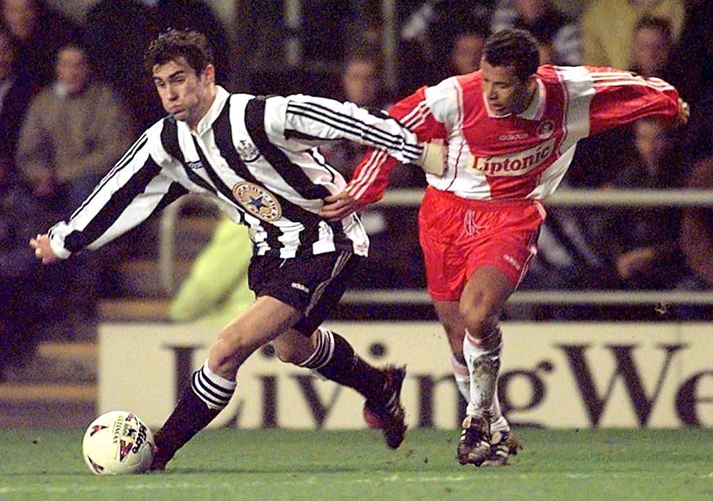 Newcastle United 's striker Keith Gillespie (L) against AS Monaco 's Lilian Martin in 04 March 1997 .
