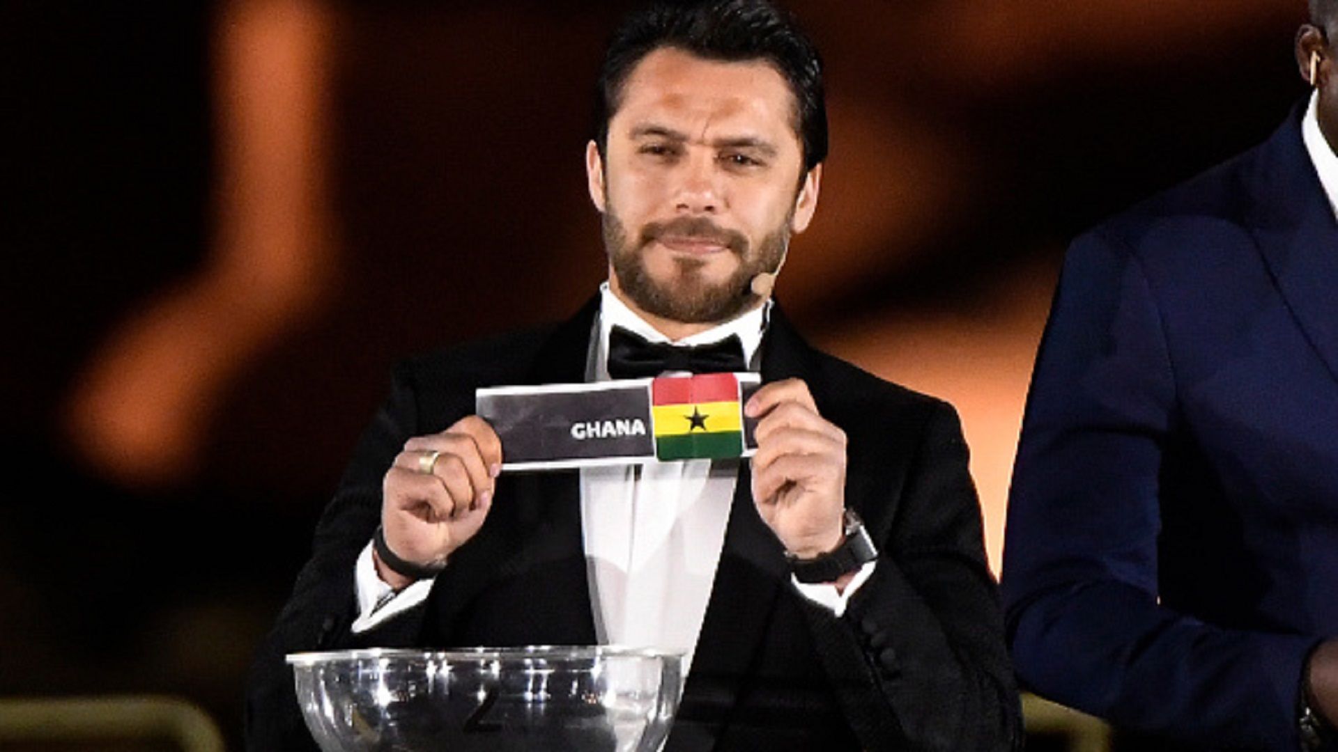 Former Egyptian player Ahmad Hasan shows Ghana's ballot during the 2019 CAF African Cup of Nations (CAN) draw