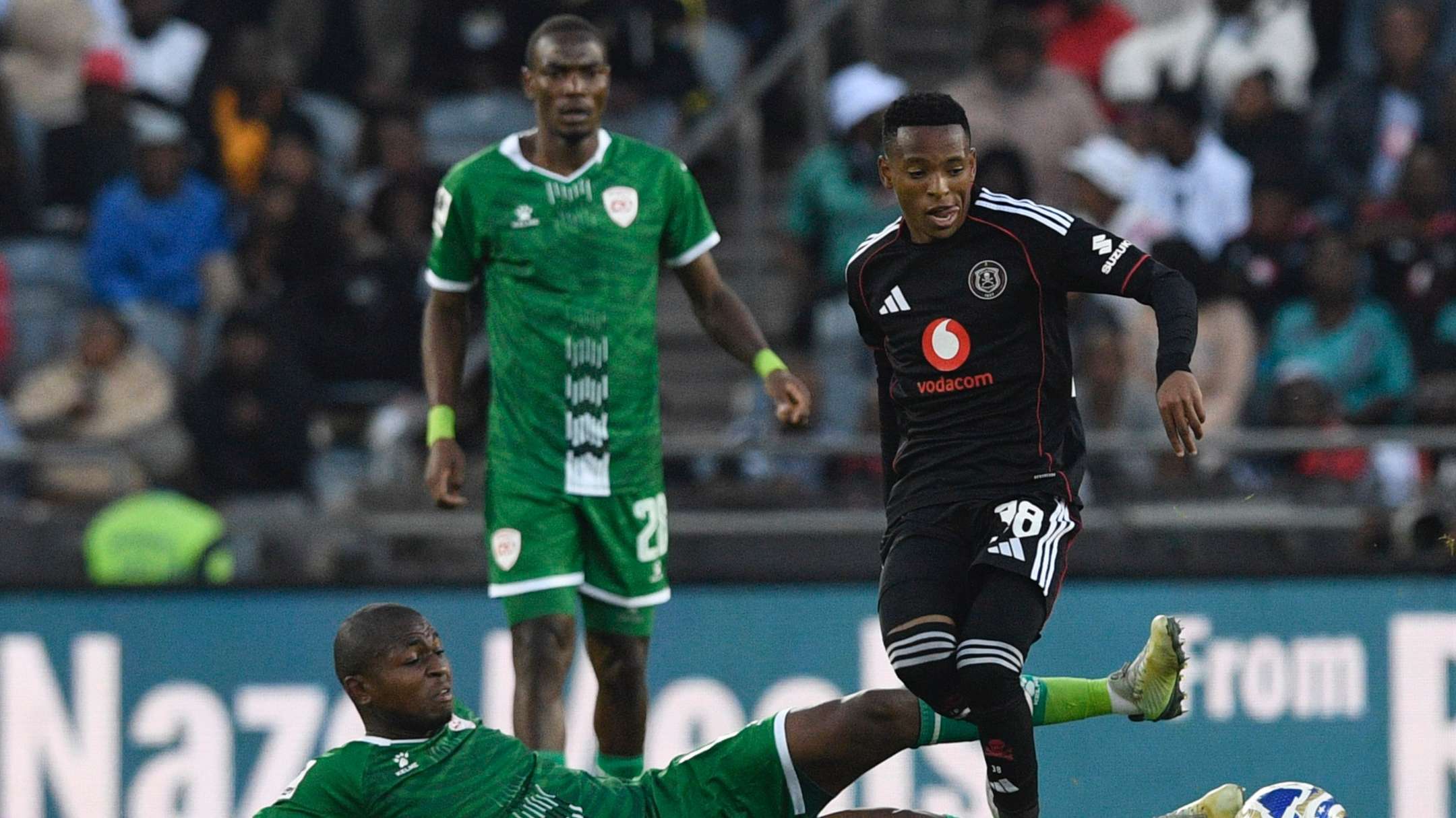 Siphesihle Mkhize of Sekhukhune United and Relebohile Mofokeng of Orlando Pirates