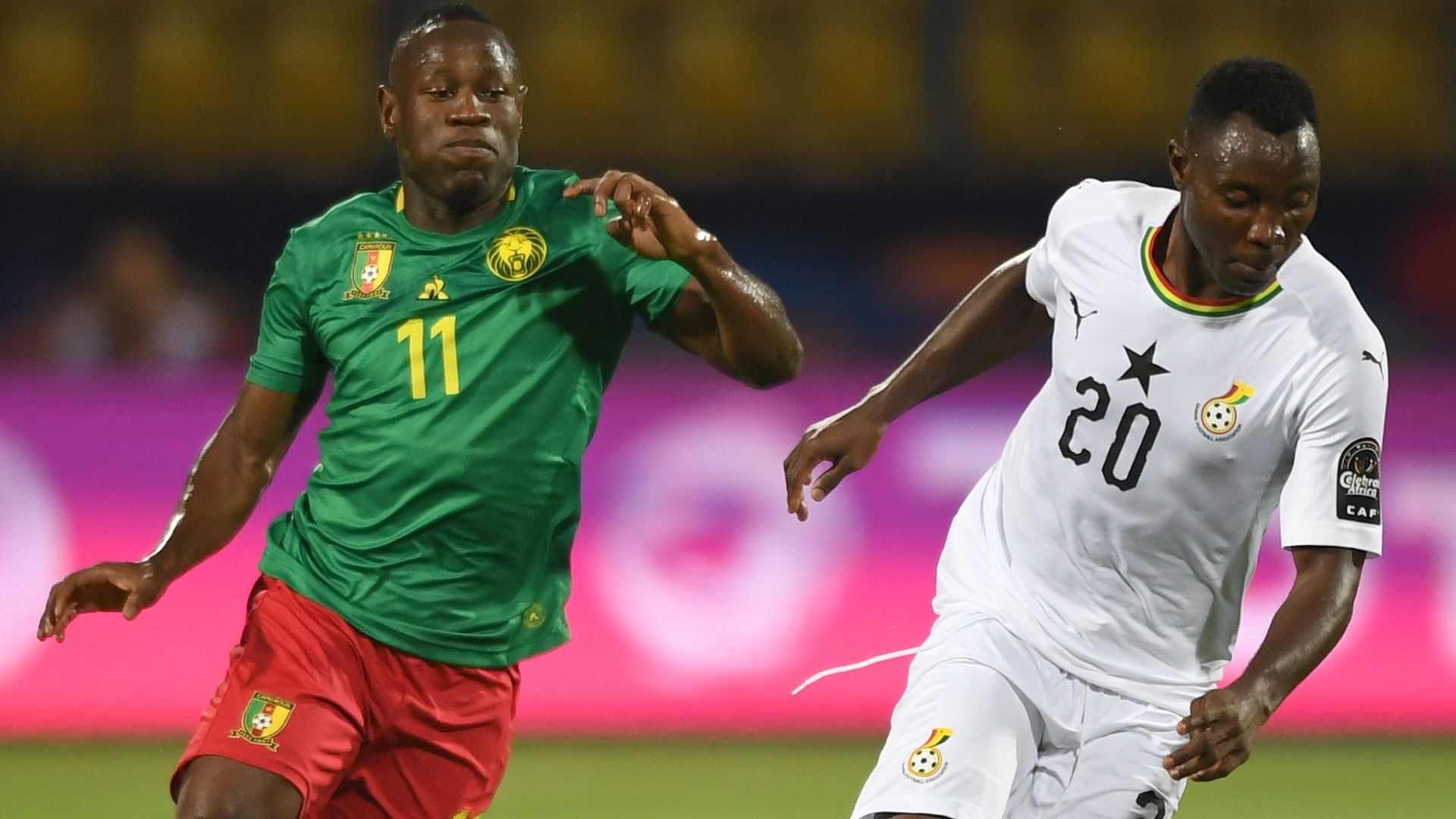 Ghana's midfielder Kwadwo Asamoah (R) is marked by Cameroon's forward Christian Bassogog during the 2019 Africa Cup of Nations.jpg