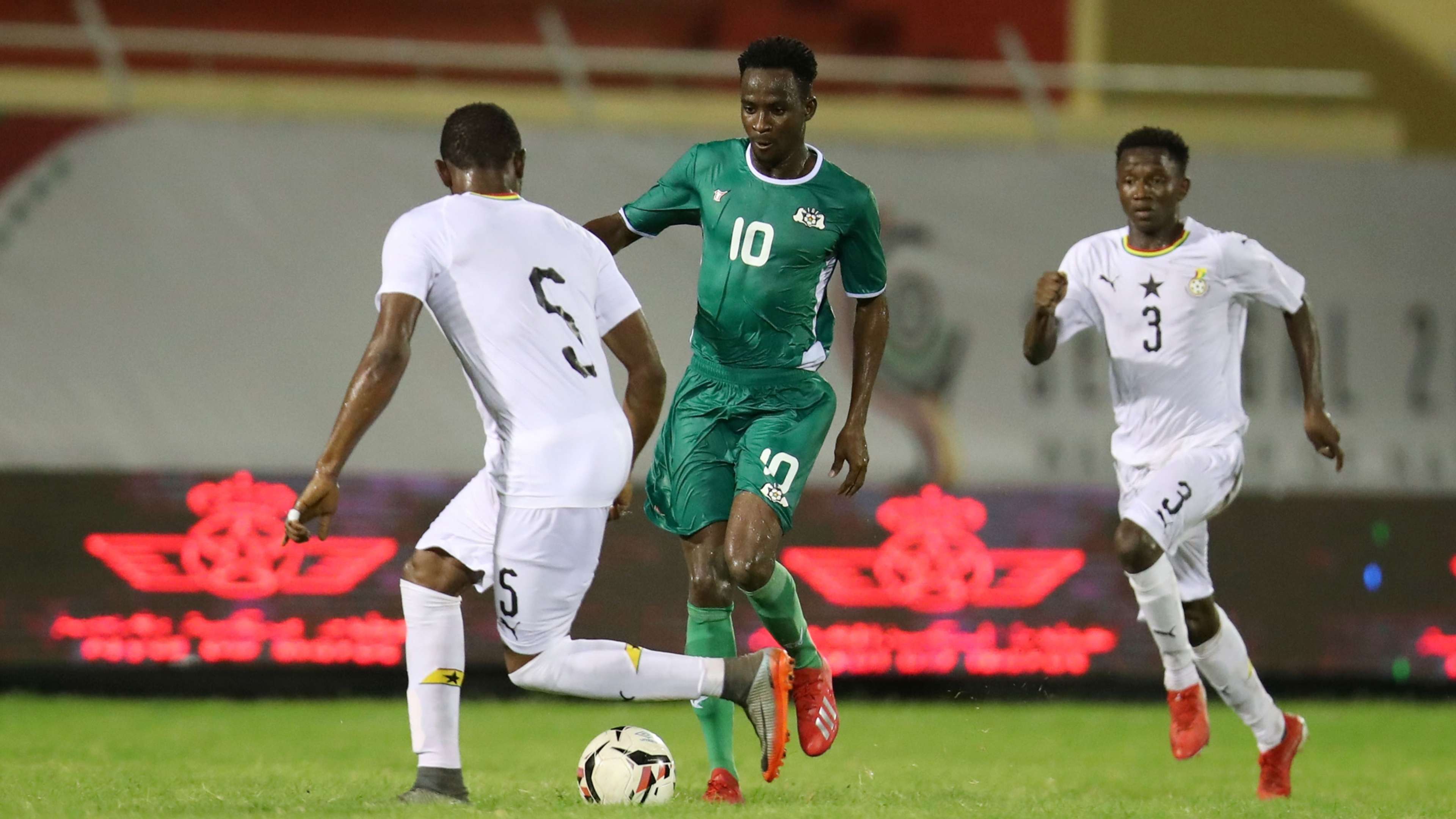 Clement Pitroipa of Burkina Faso takes on Ghana at the Wafu Cup