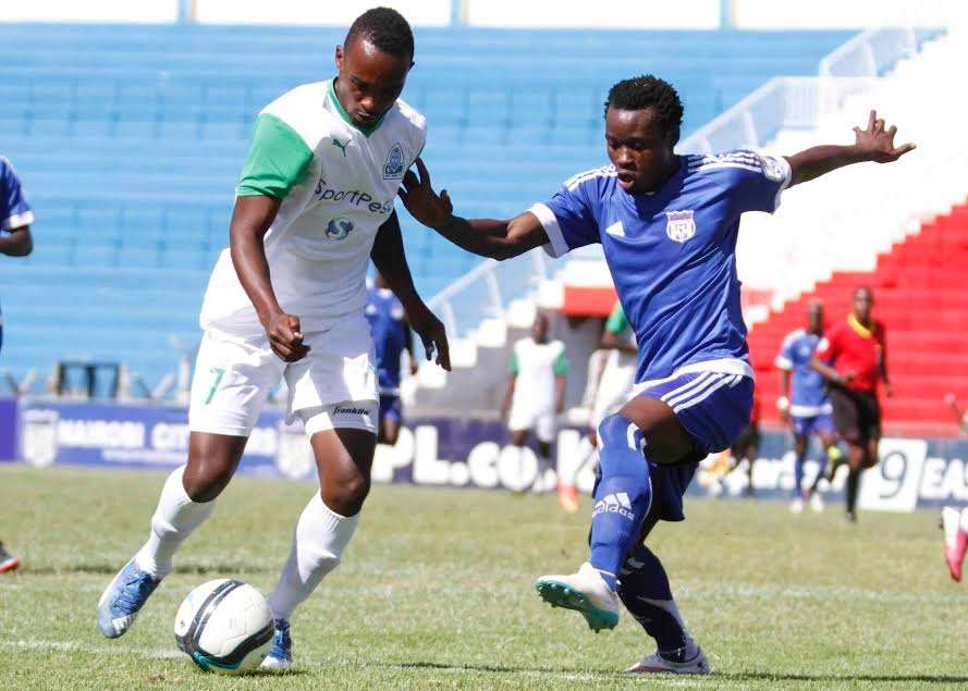 Gor Mahia's Ronald Omino tackle Calvin Masawa of City Stars