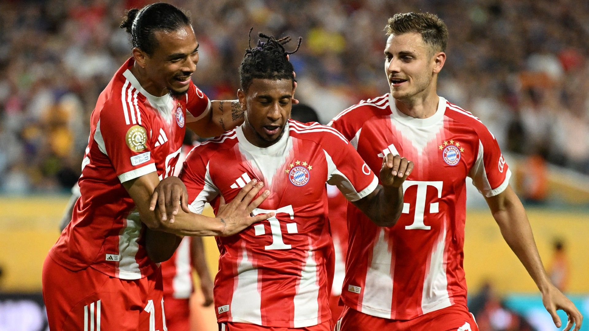 Bayern Munich's French midfielder #17 Michael Olise (C) celebrates scoring his team's second goal 