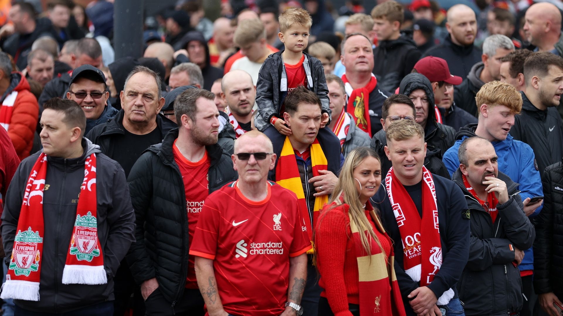 Liverpool fans wait for team bus