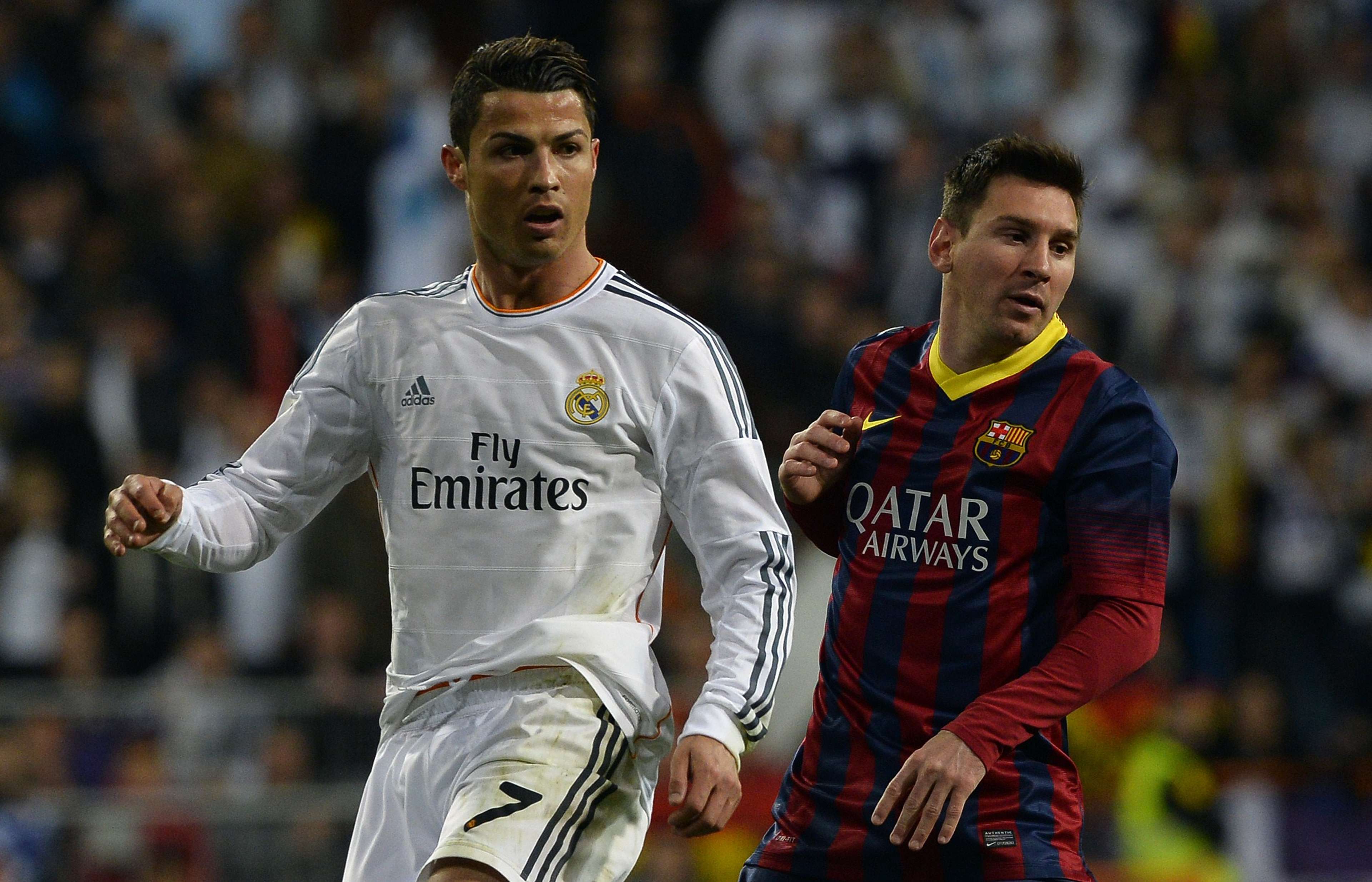 Real Madrid's Cristiano Ronaldo (L) and Barcelona's Lionel Messi