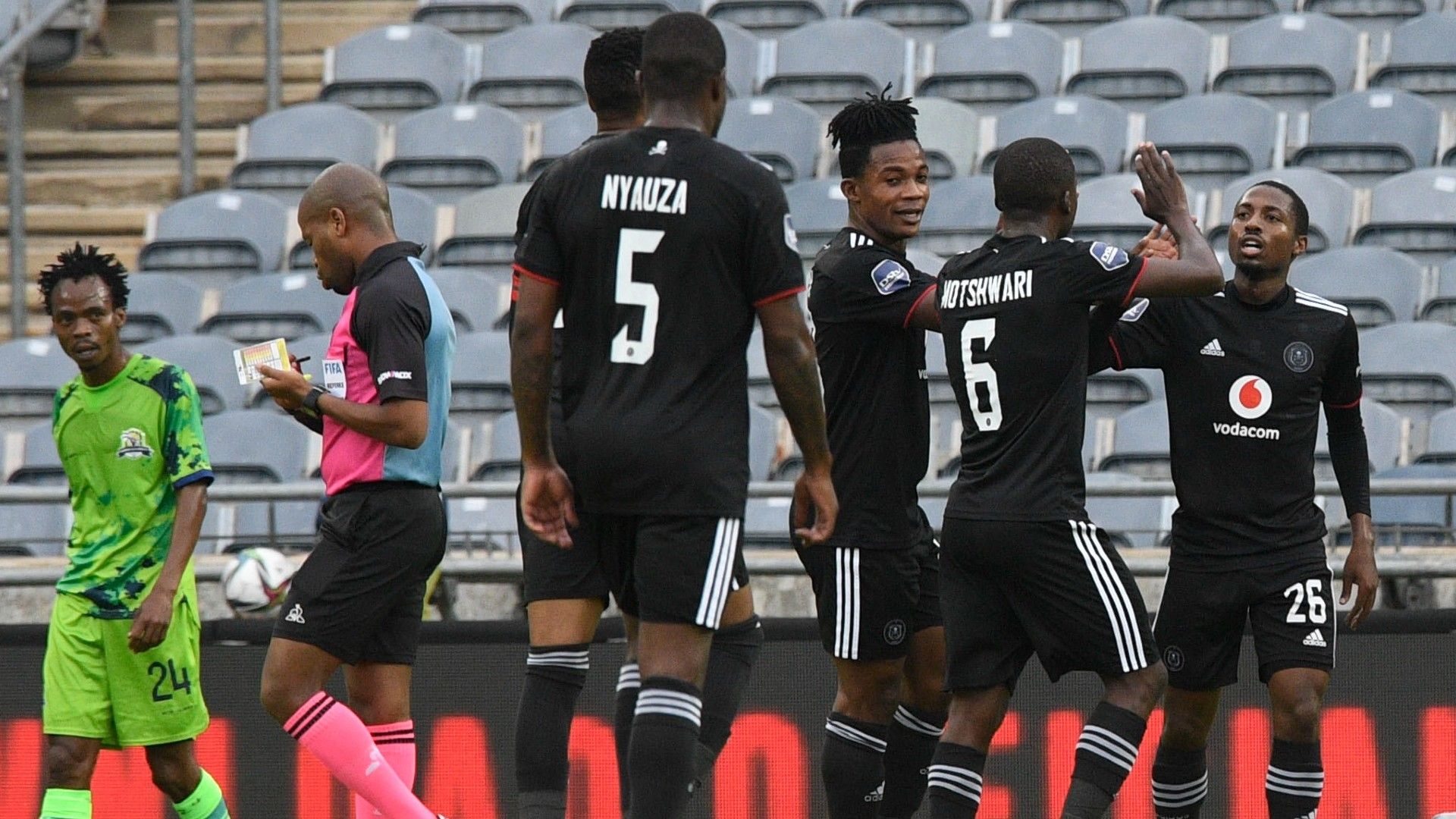 Terrence Dzukamanja of Orlando Pirates challenges Philip Ndlondlo of Marumo Gallants.