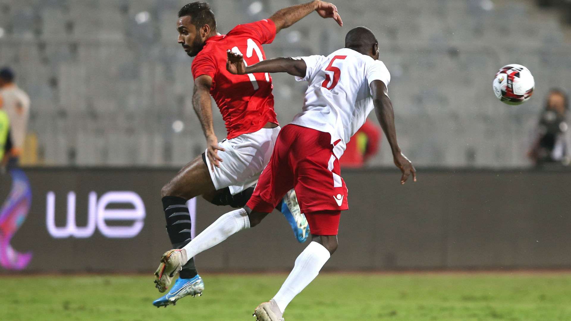 Egypt 's Mahmoud Kahraba (l ) in action against Kenya and Harambee Stars defender Joash Onyango.