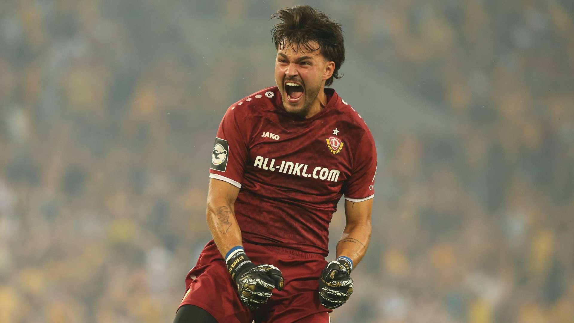 Goalkeeper Tim Stanislaw Schreiber of Dresden celebrates