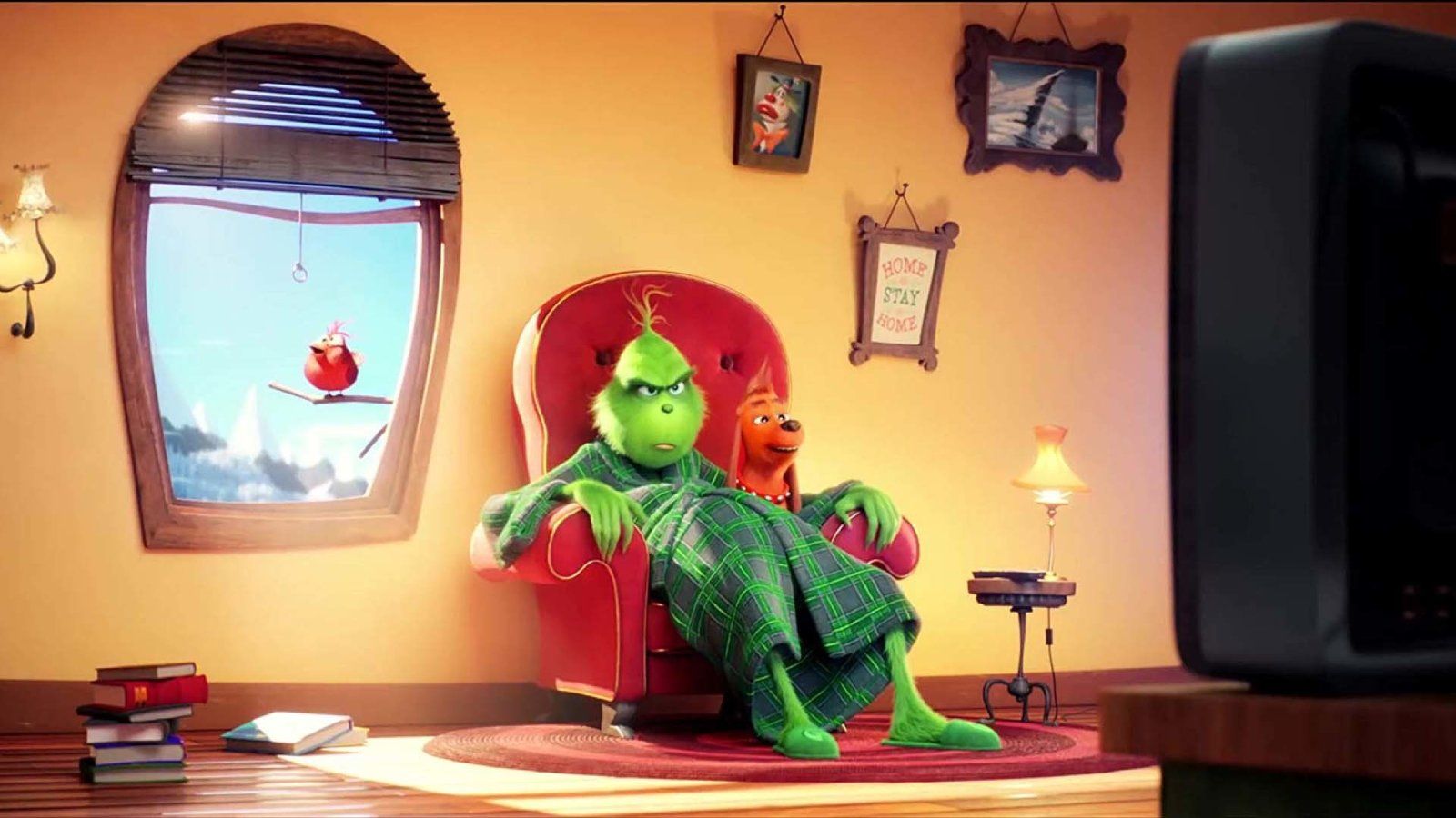 The Grinch (2018) sitting in his chair.