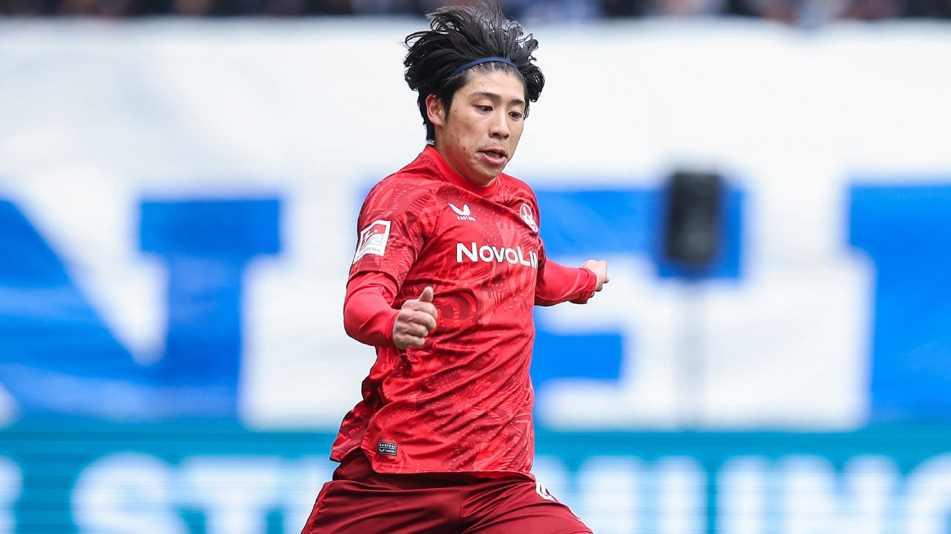 Daisuke Yokota of 1. FC Kaiserslautern runs with the ball