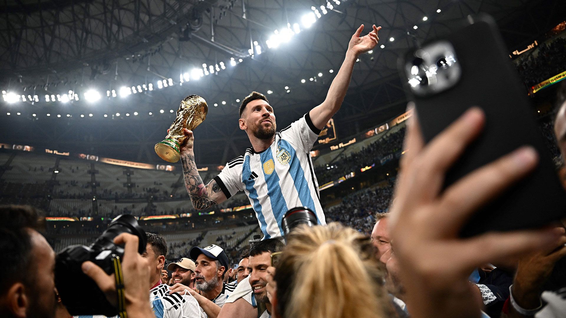Lionel Messi lifts the World Cup trophy for Argentina at the 2022 World Cup in Qatar